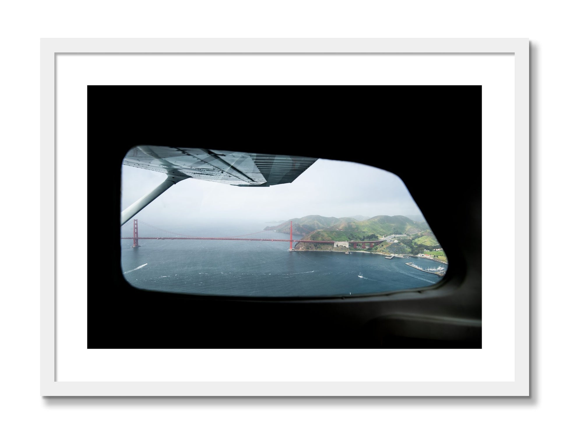 Framed photograph of Flying Over The Gate by Dylan Ozanich, White frame, Borders