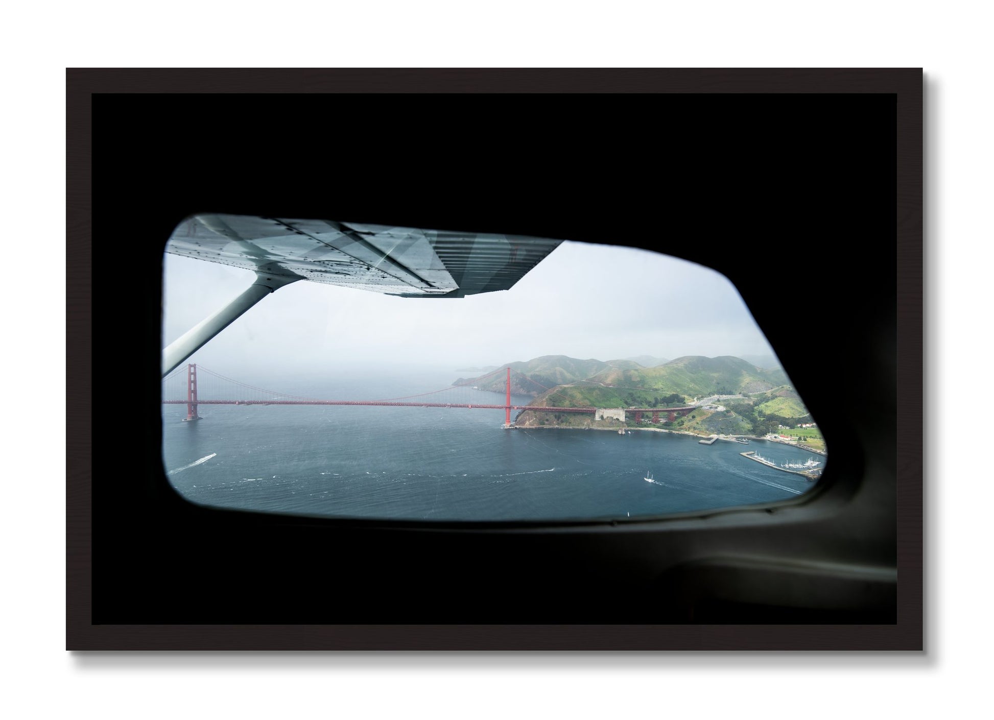 Framed photograph of Flying Over The Gate by Dylan Ozanich, Black Walnut frame, Full Bleed