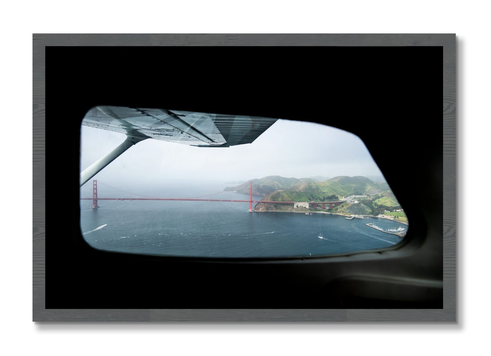 Framed photograph of Flying Over The Gate by Dylan Ozanich, Grey frame, Full Bleed