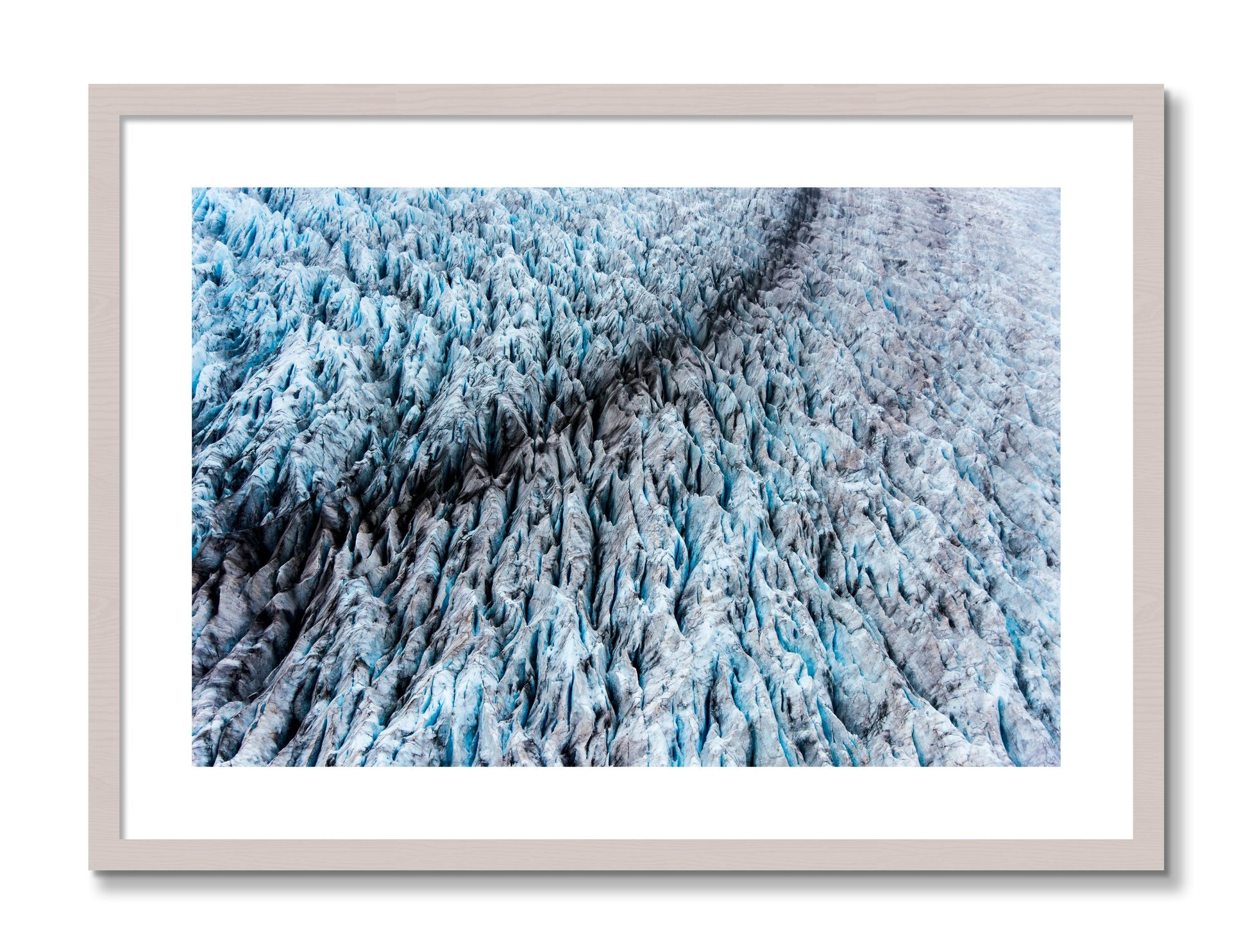Framed photograph of Glacier by Dylan Ozanich, White Maple frame, Borders