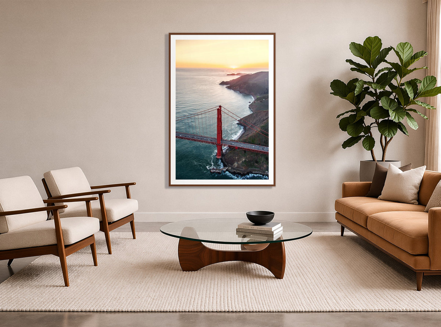 Golden Gate At Dusk by Dylan Ozanich in a Walnut frame, in a midcentury living room with a tan leather sofa and fiddle-leaf fig
