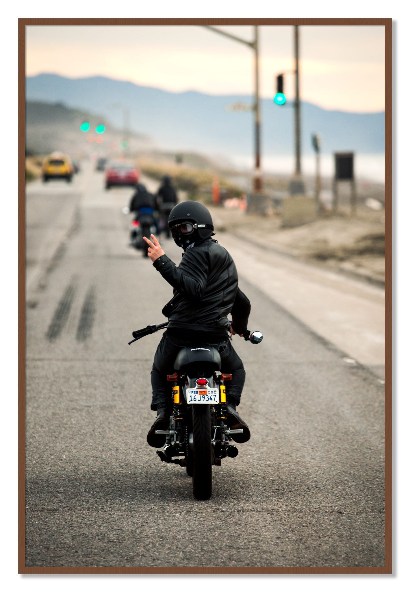 Framed photograph of Great Highway Riding by Dylan Ozanich, Walnut frame, Full Bleed