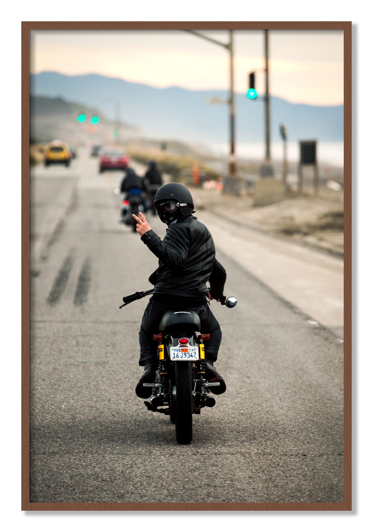Framed photograph of Great Highway Riding by Dylan Ozanich, Walnut frame, Full Bleed