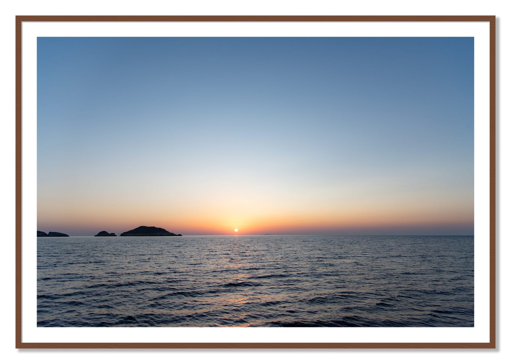 Framed photograph of Greek Ocean by Dylan Ozanich, Walnut frame, Borders