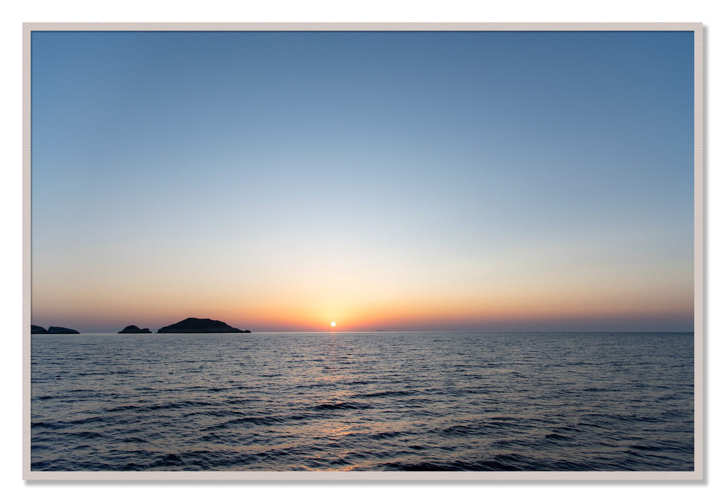 Framed photograph of Greek Ocean by Dylan Ozanich, White Maple frame, Full Bleed