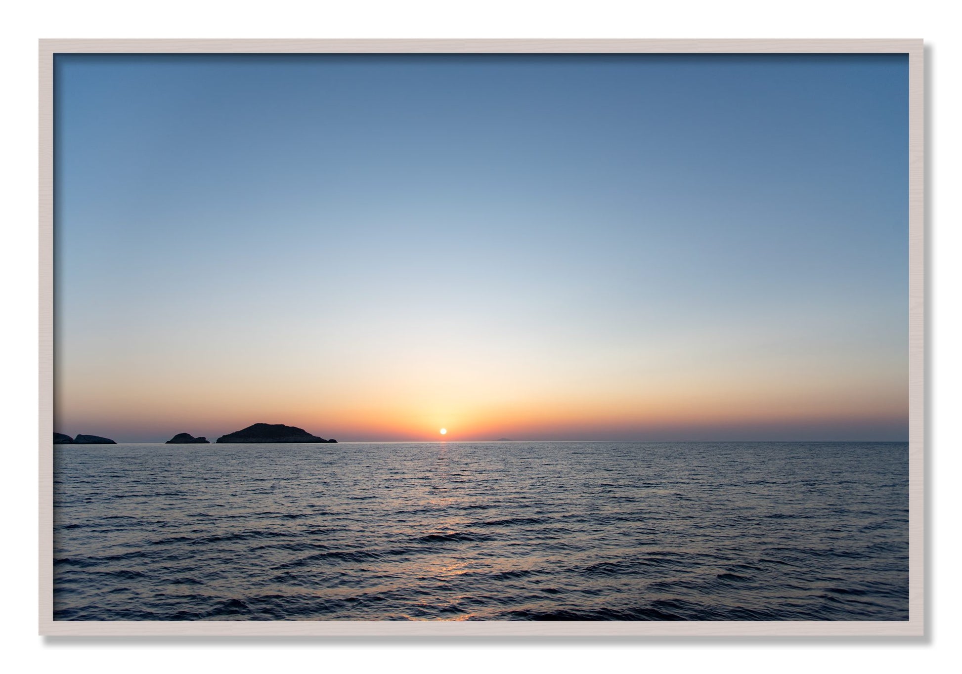 Framed photograph of Greek Ocean by Dylan Ozanich, White Maple frame, Full Bleed