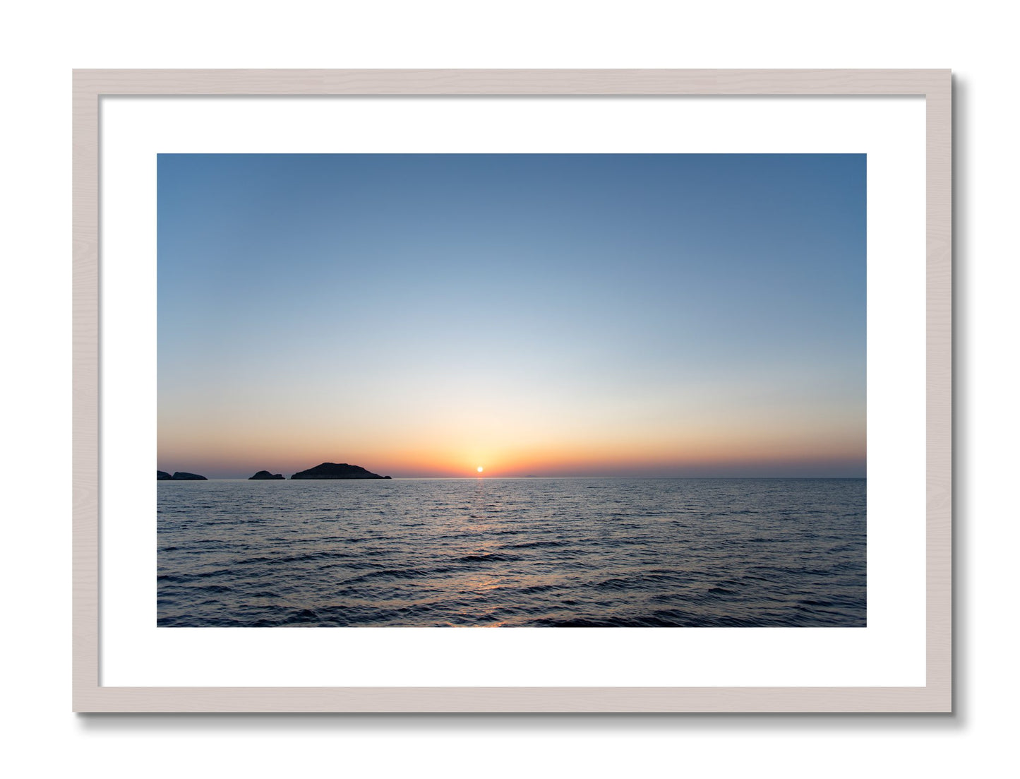 Framed photograph of Greek Ocean by Dylan Ozanich, White Maple frame, Borders