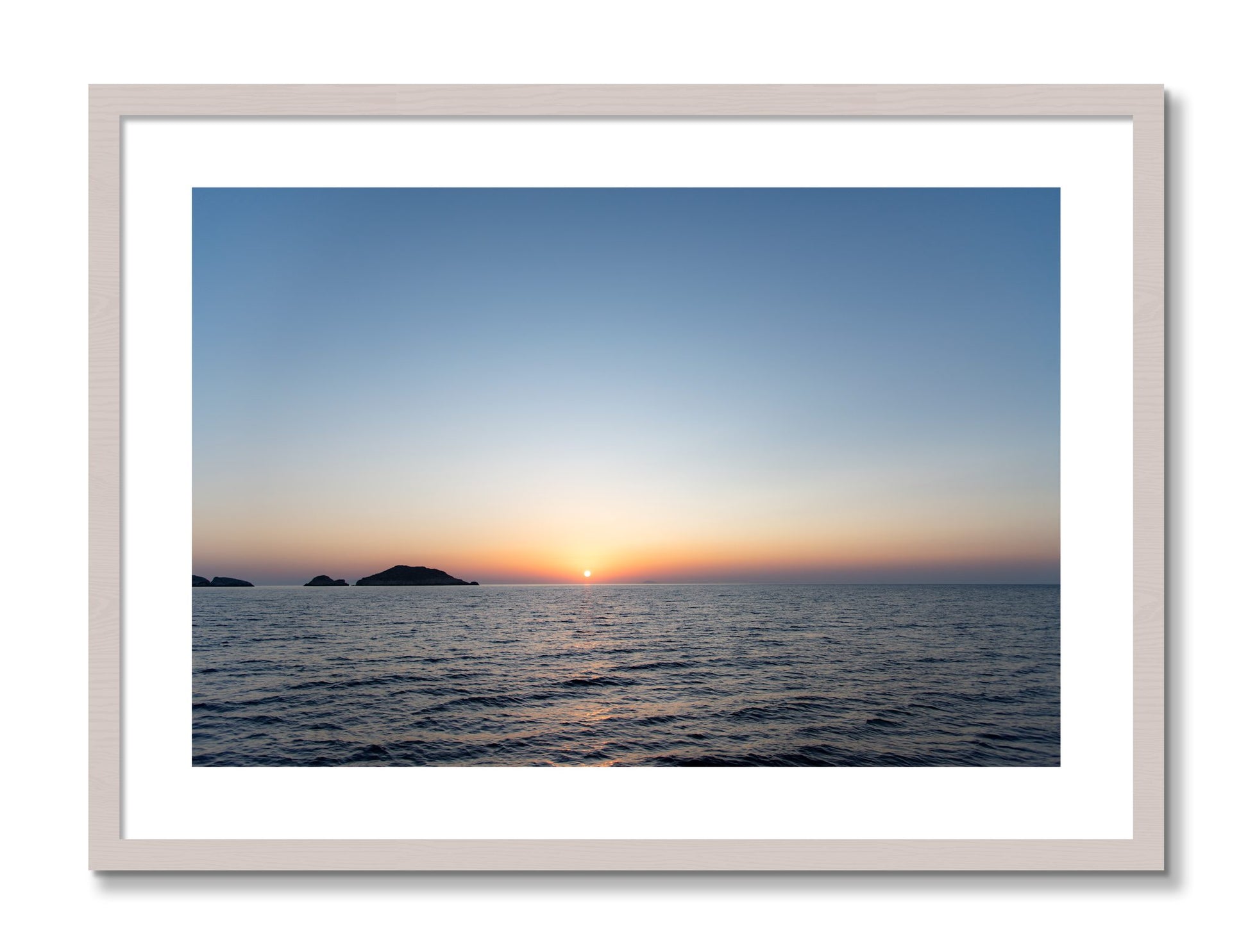 Framed photograph of Greek Ocean by Dylan Ozanich, White Maple frame, Borders