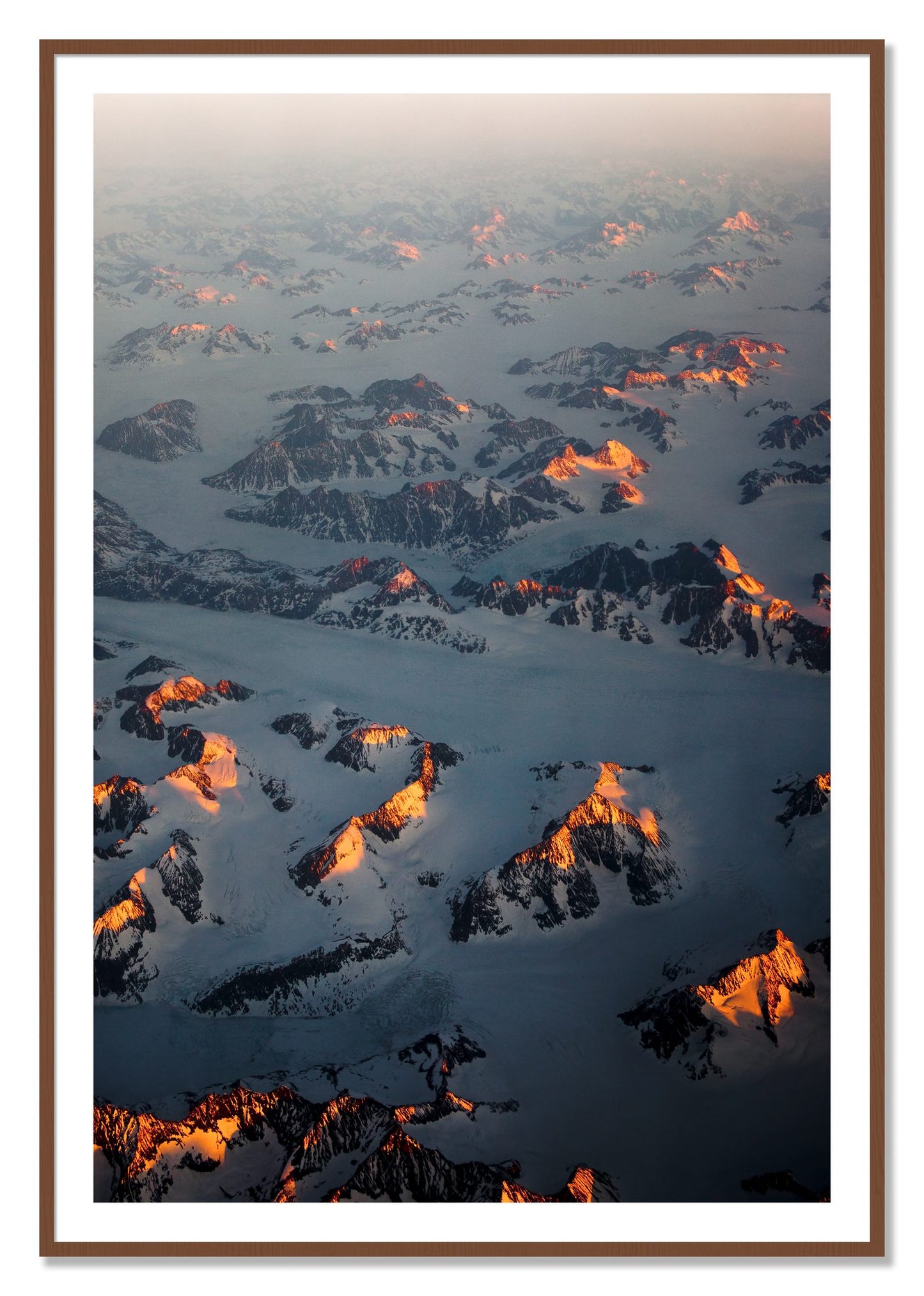 Framed photograph of Greenland Light by Dylan Ozanich, Walnut frame, Borders