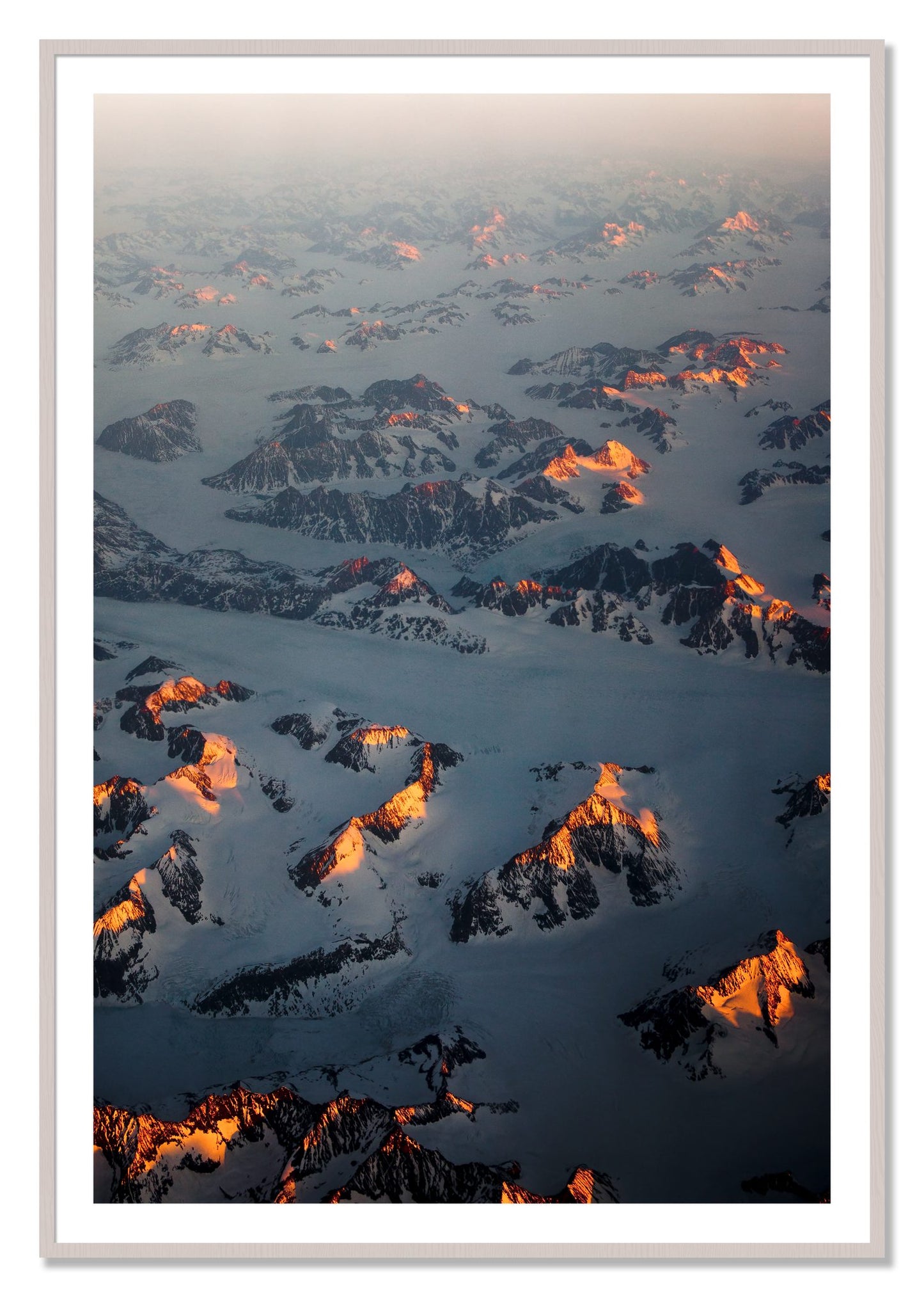 Framed photograph of Greenland Light by Dylan Ozanich, White Maple frame, Borders