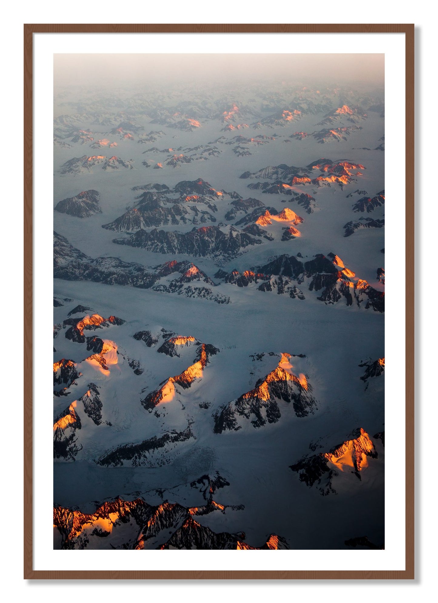 Framed photograph of Greenland Light by Dylan Ozanich, Walnut frame, Borders