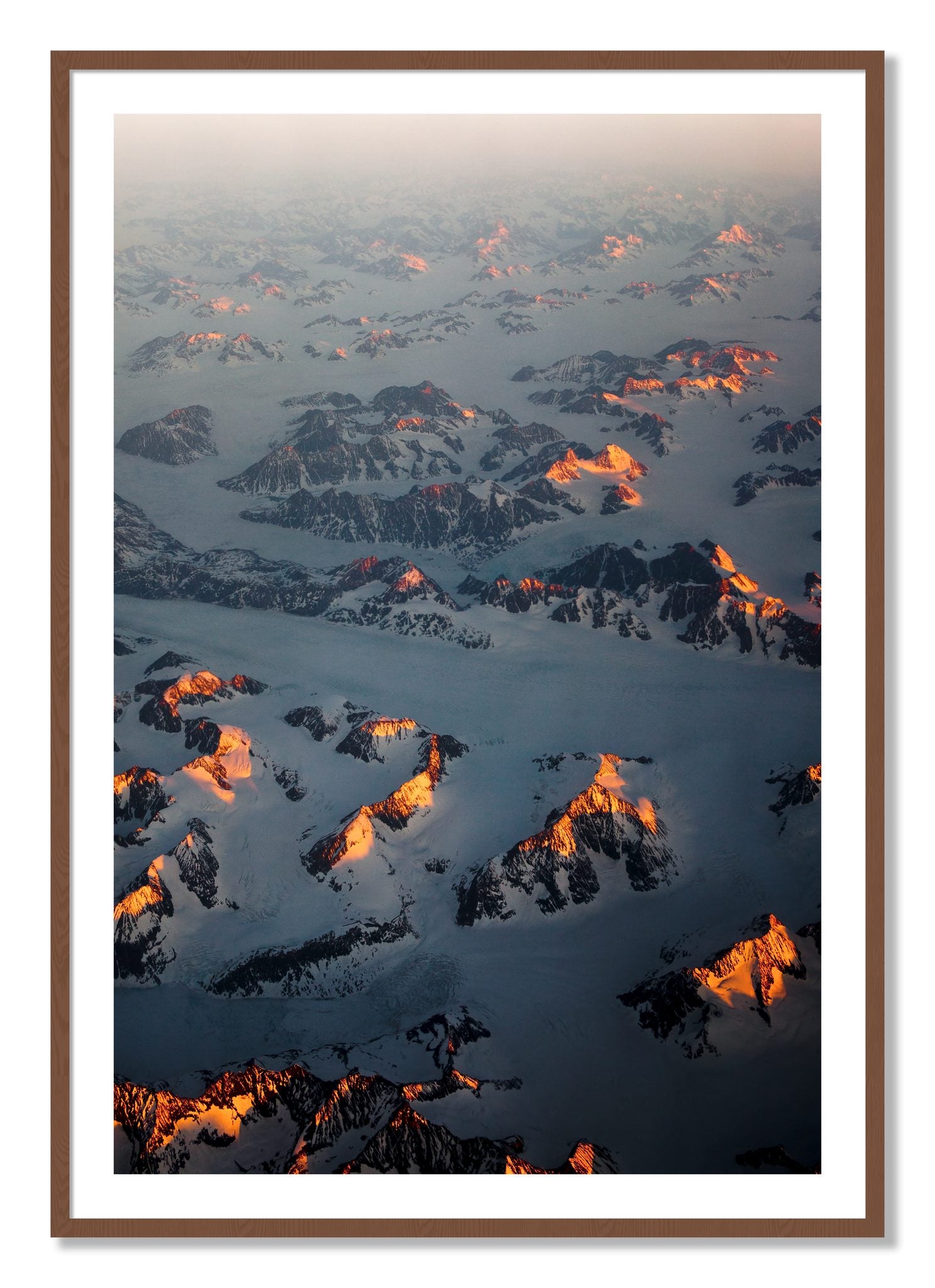 Framed photograph of Greenland Light by Dylan Ozanich, Walnut frame, Borders