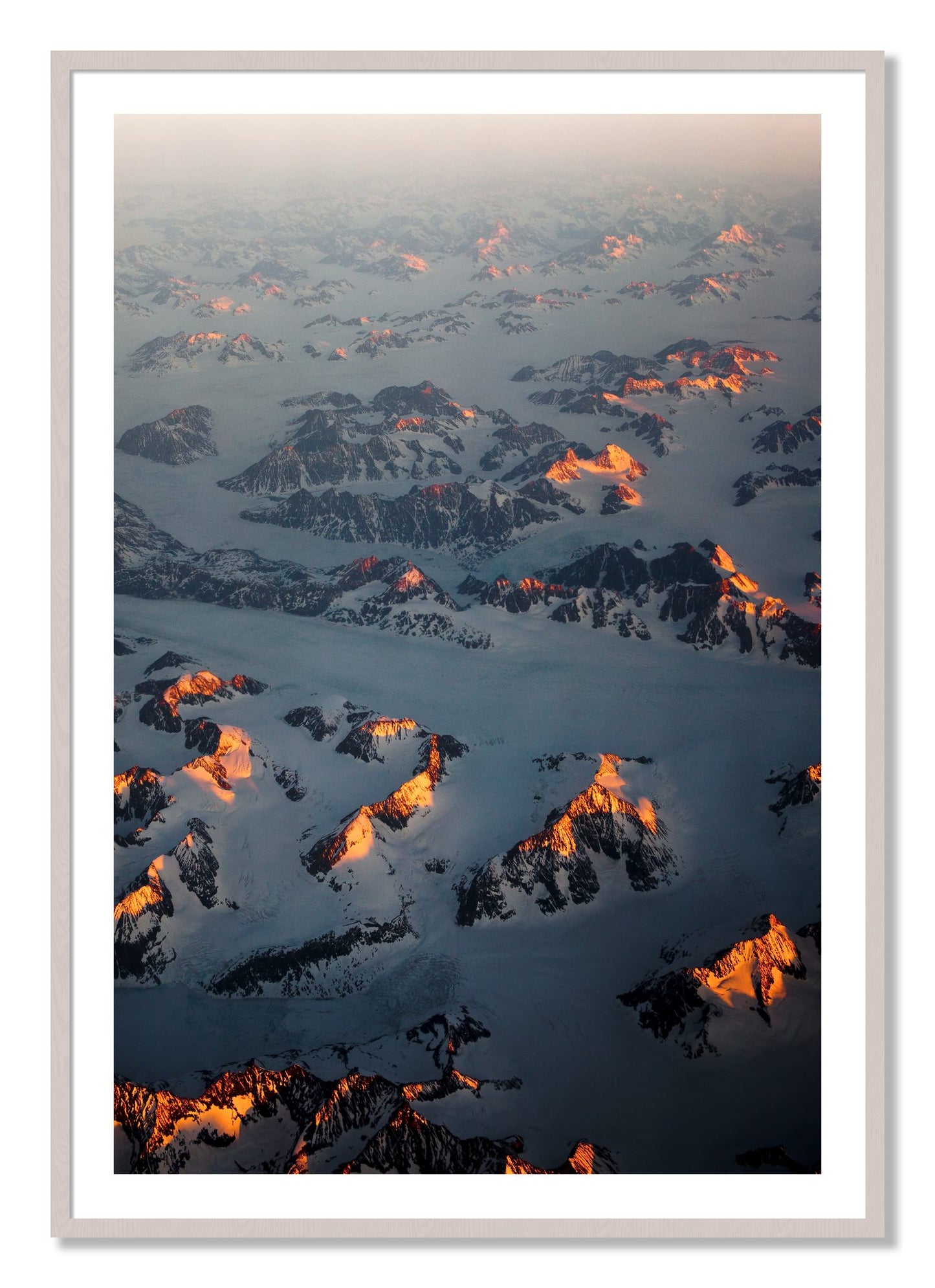 Framed photograph of Greenland Light by Dylan Ozanich, White Maple frame, Borders