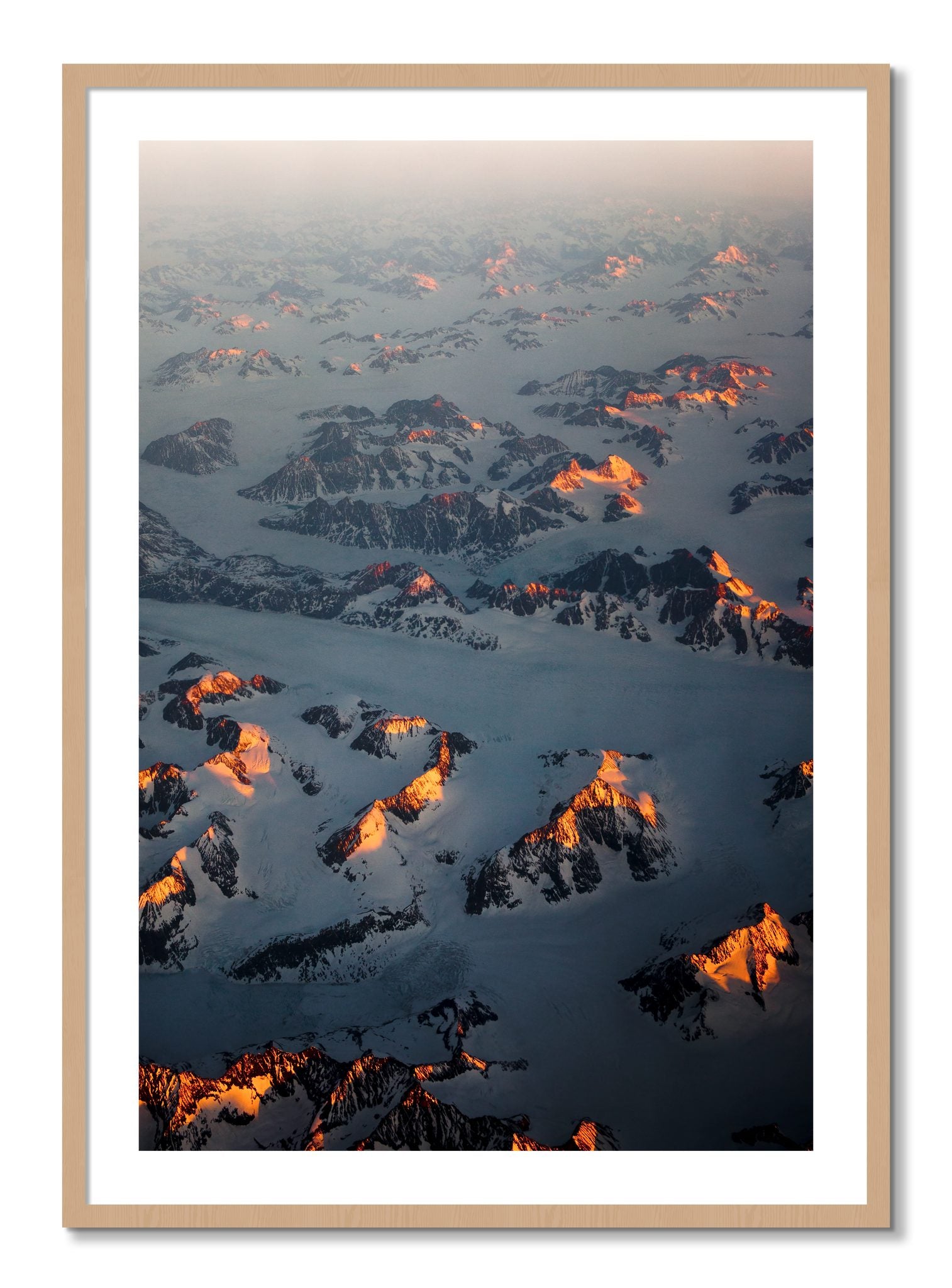 Framed photograph of Greenland Light by Dylan Ozanich, Oak frame, Borders