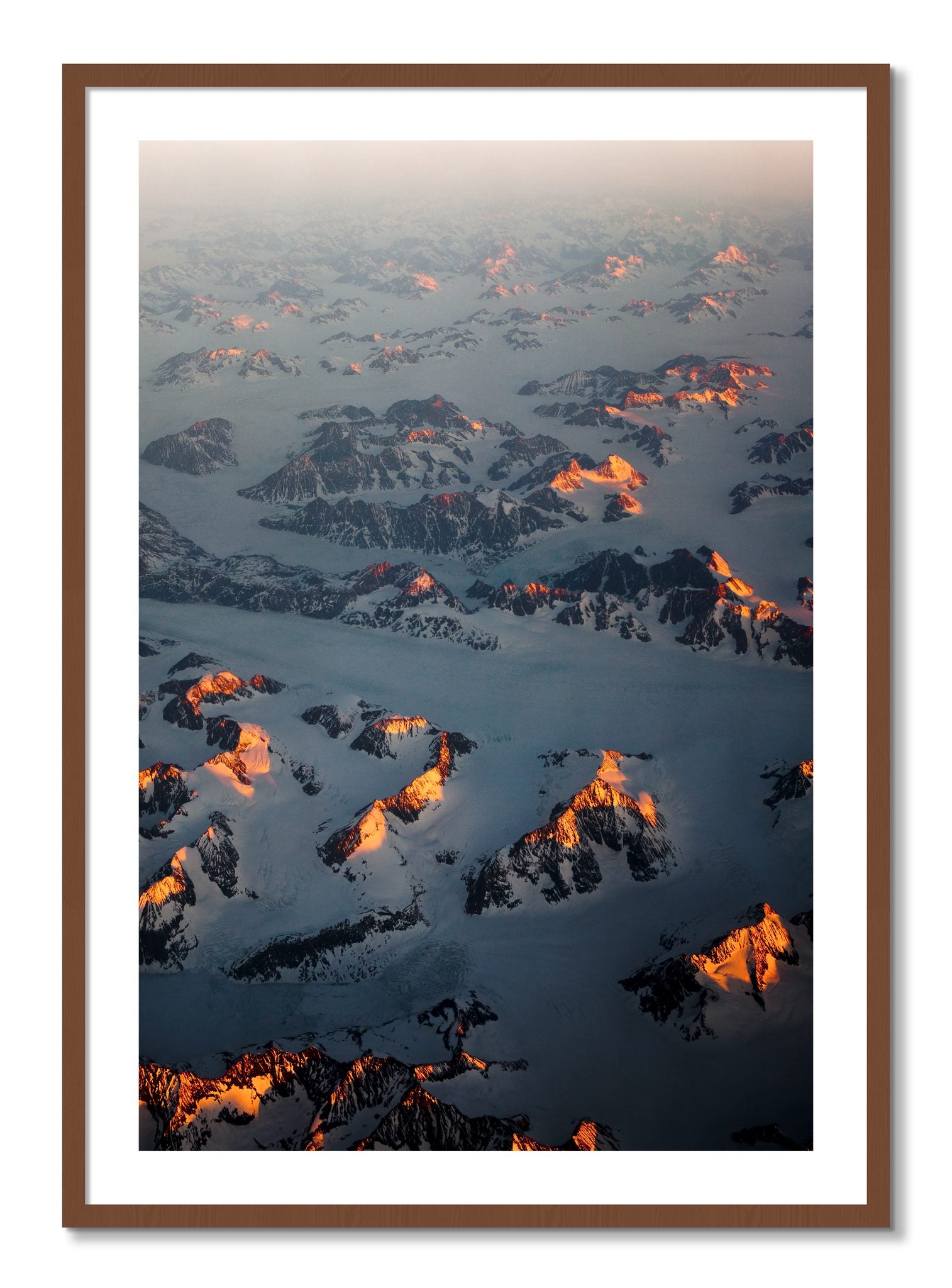Framed photograph of Greenland Light by Dylan Ozanich, Walnut frame, Borders