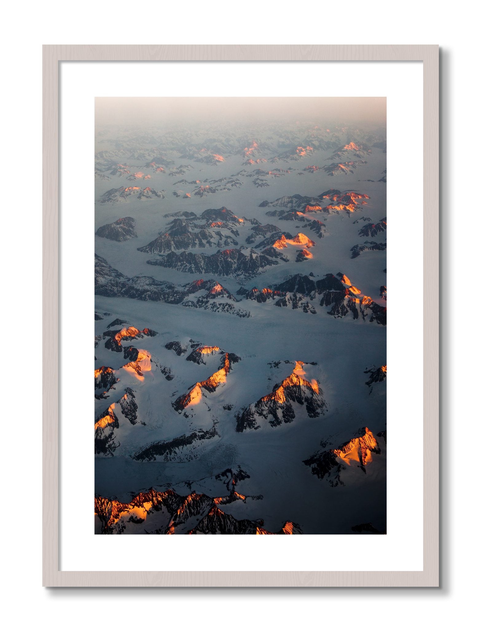 Framed photograph of Greenland Light by Dylan Ozanich, White Maple frame, Borders