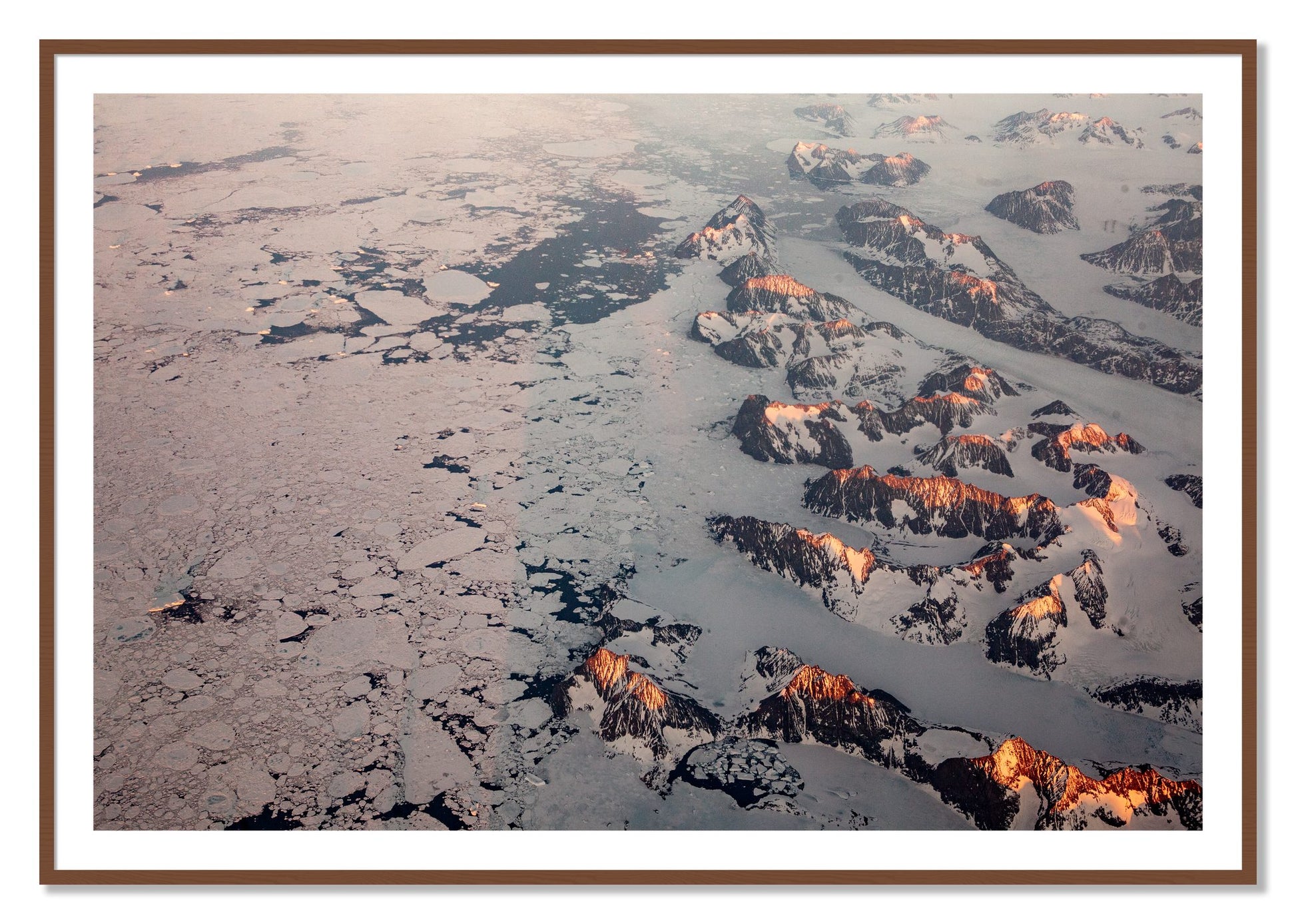 Framed photograph of Greenland Peaks by Dylan Ozanich, Walnut frame, Borders