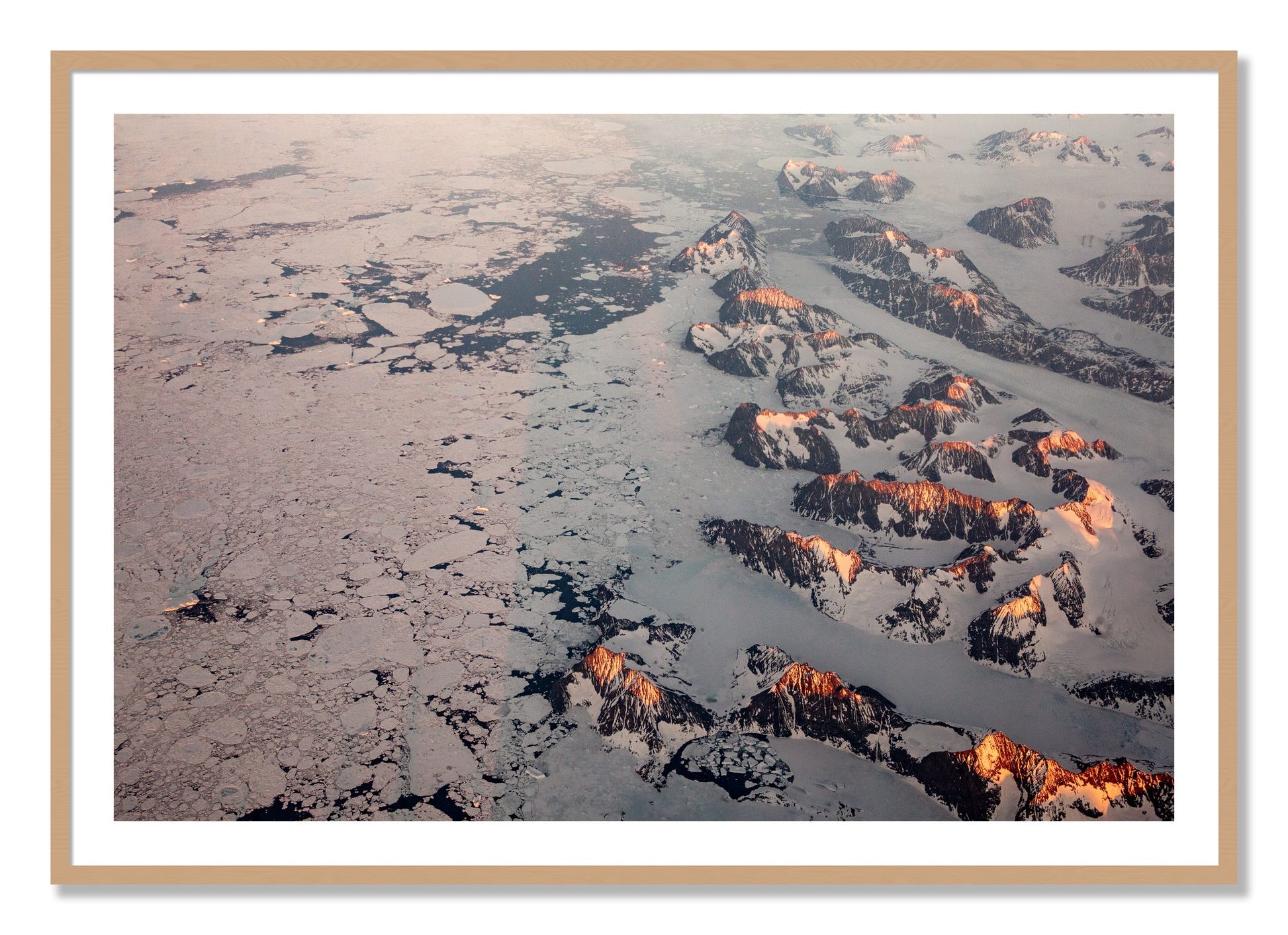Framed photograph of Greenland Peaks by Dylan Ozanich, Oak frame, Borders