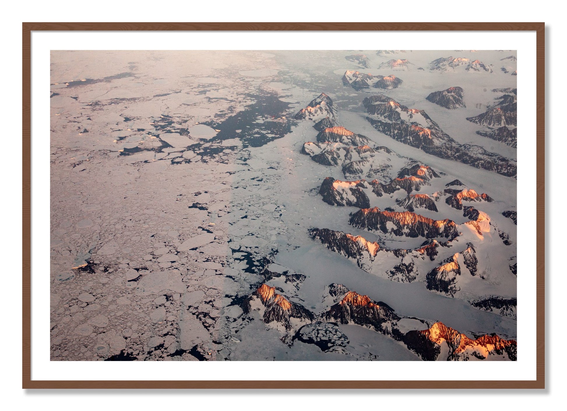 Framed photograph of Greenland Peaks by Dylan Ozanich, Walnut frame, Borders
