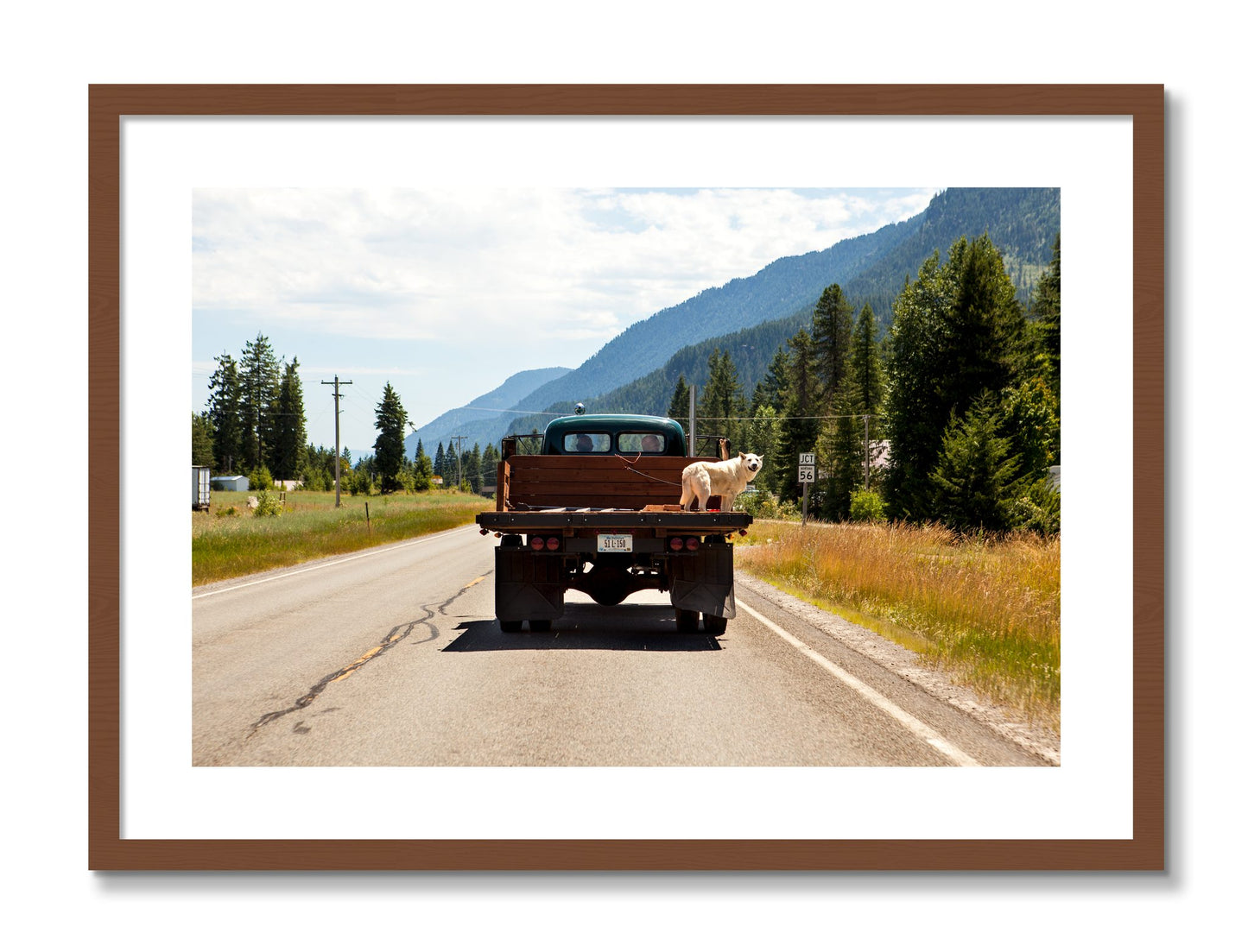 Framed photograph of Heading To Town by Dylan Ozanich, Walnut frame, Borders