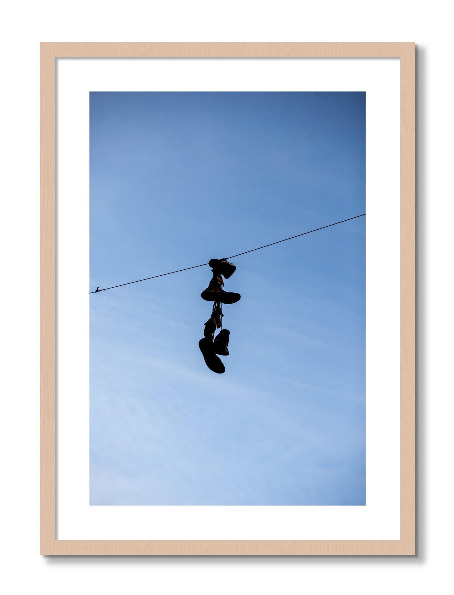 Framed photograph of Kicks by Dylan Ozanich, Maple frame, Borders