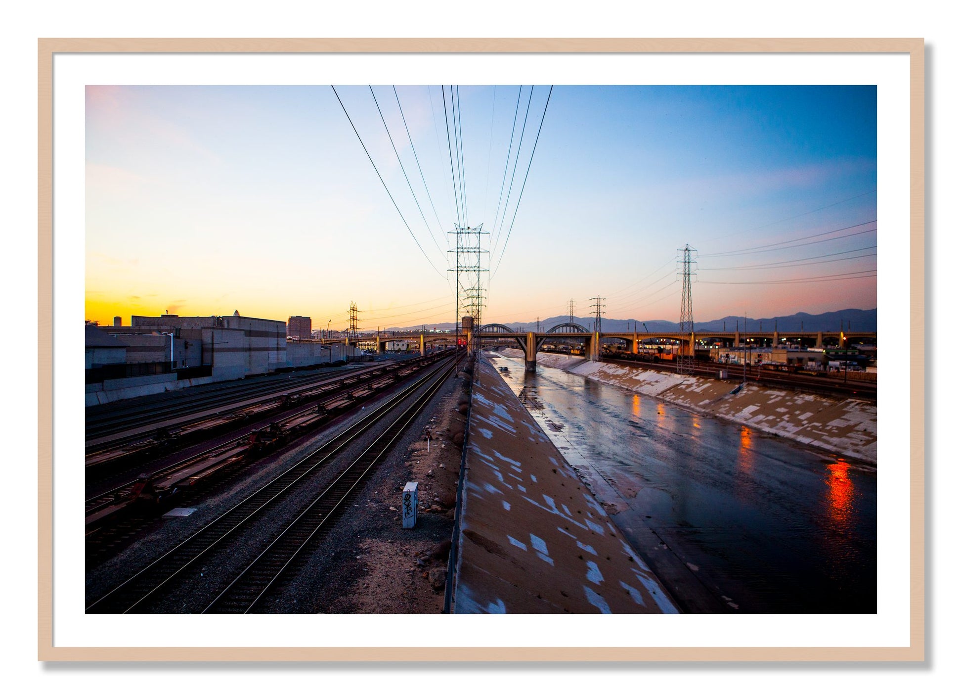 Framed photograph of LARiver by Dylan Ozanich, Maple frame, Borders