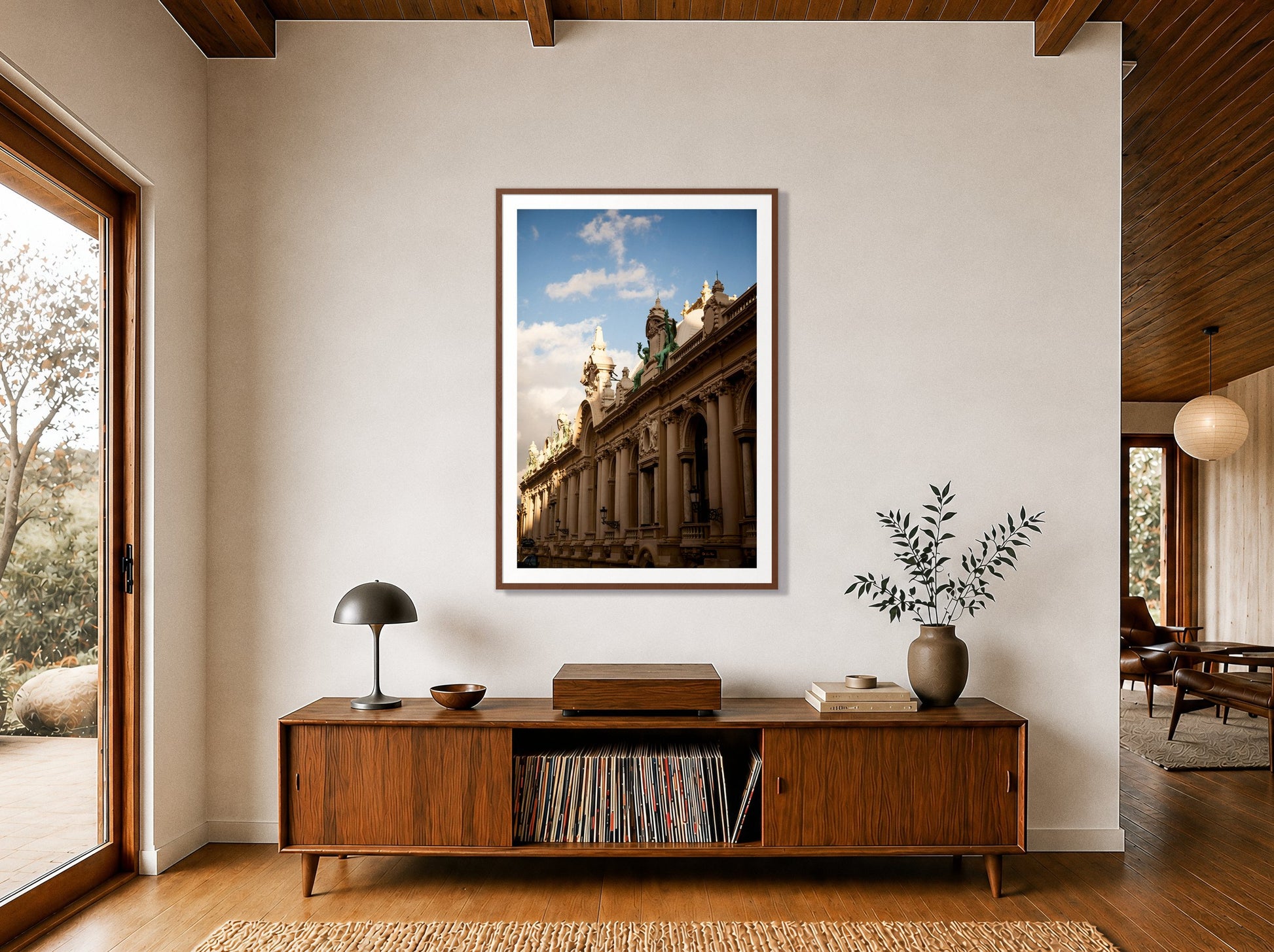 Monoco by Dylan Ozanich in a Walnut frame, above a walnut record credenza in a wood-beamed midcentury room