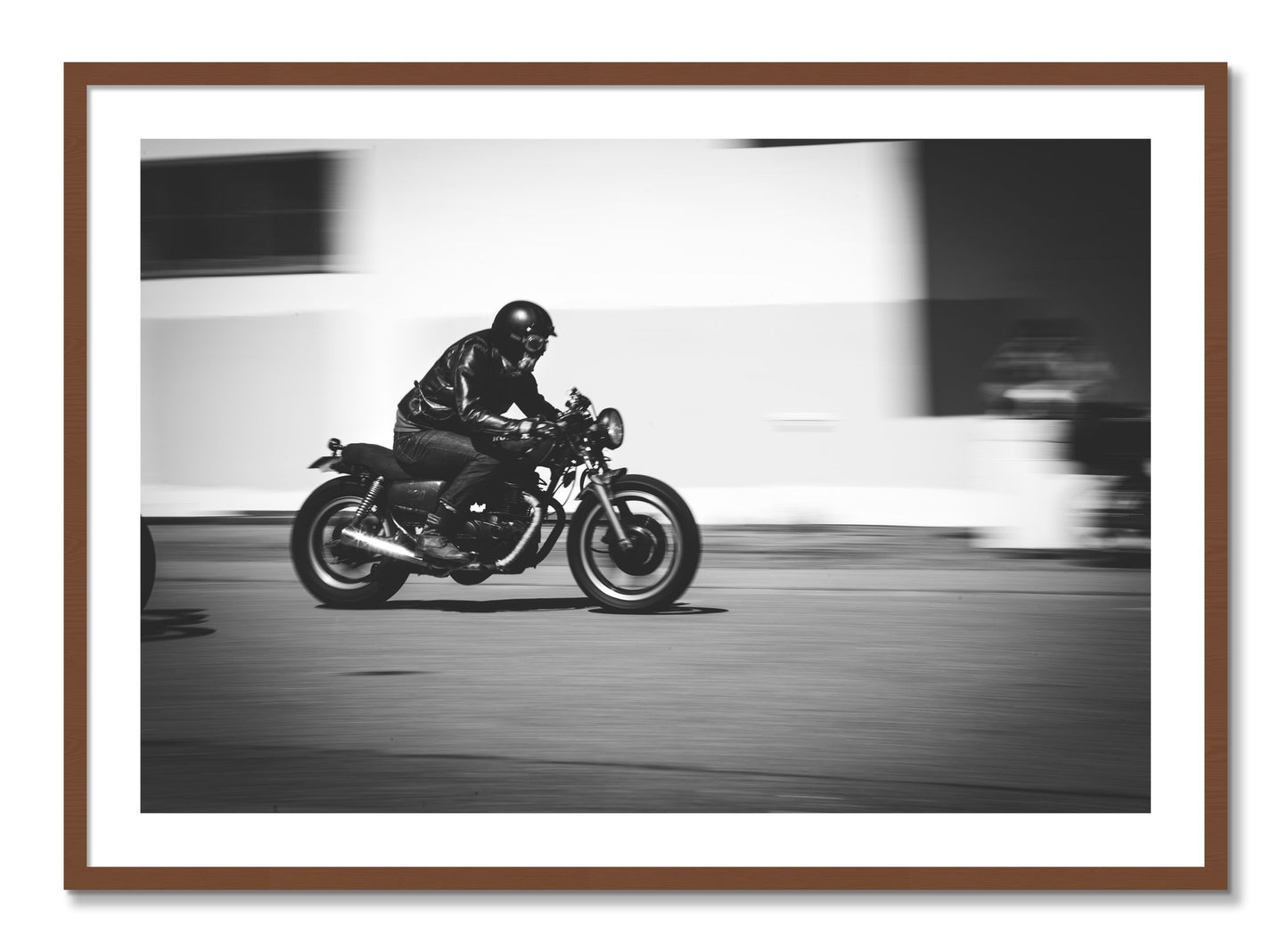 Framed photograph of Moto Blurred by Dylan Ozanich, Walnut frame, Borders