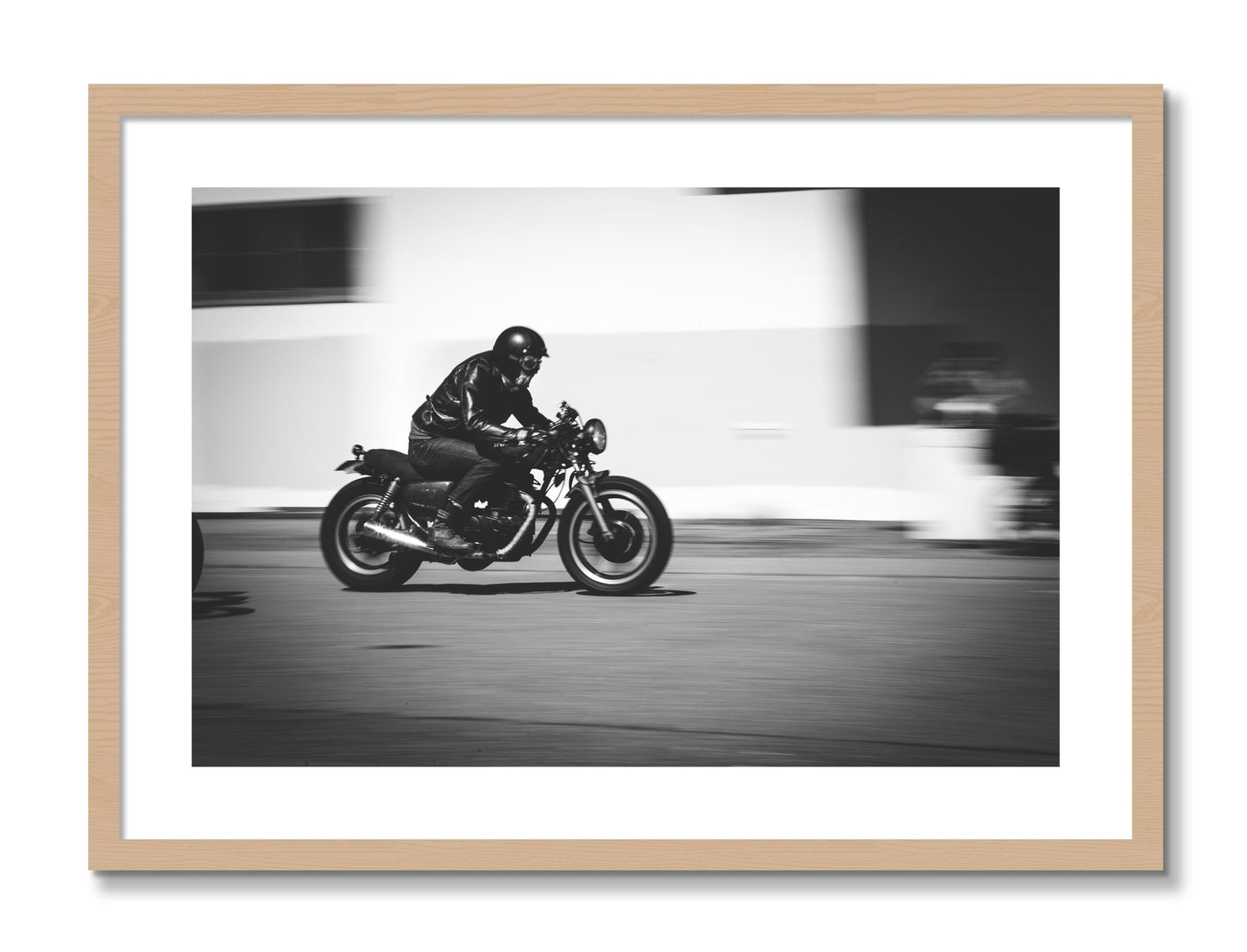 Framed photograph of Moto Blurred by Dylan Ozanich, Oak frame, Borders