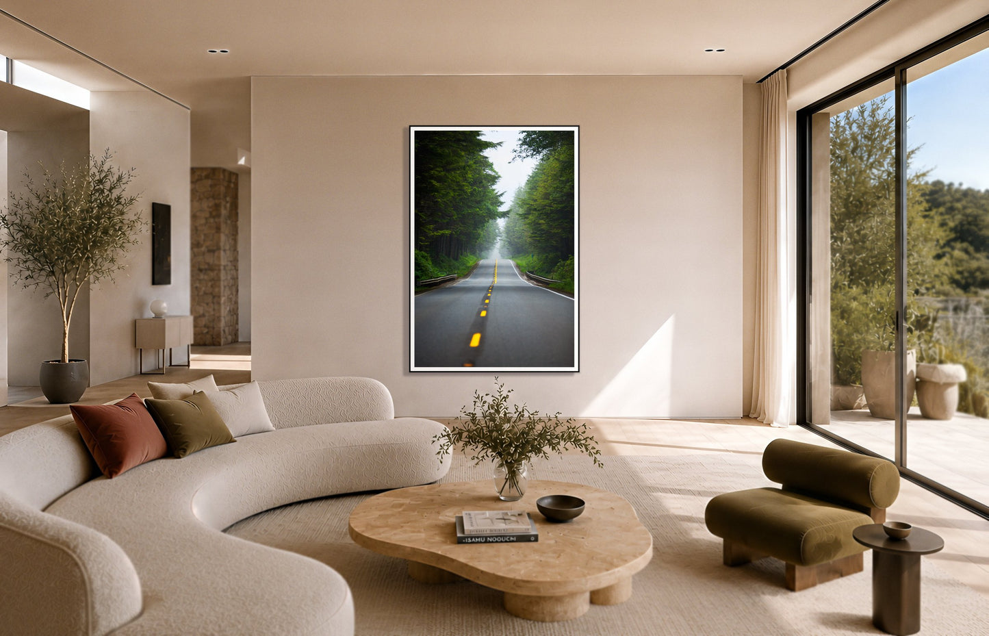 North West by Dylan Ozanich in a Black frame, above a cream curved sofa in a sunlit room with olive velvet seating