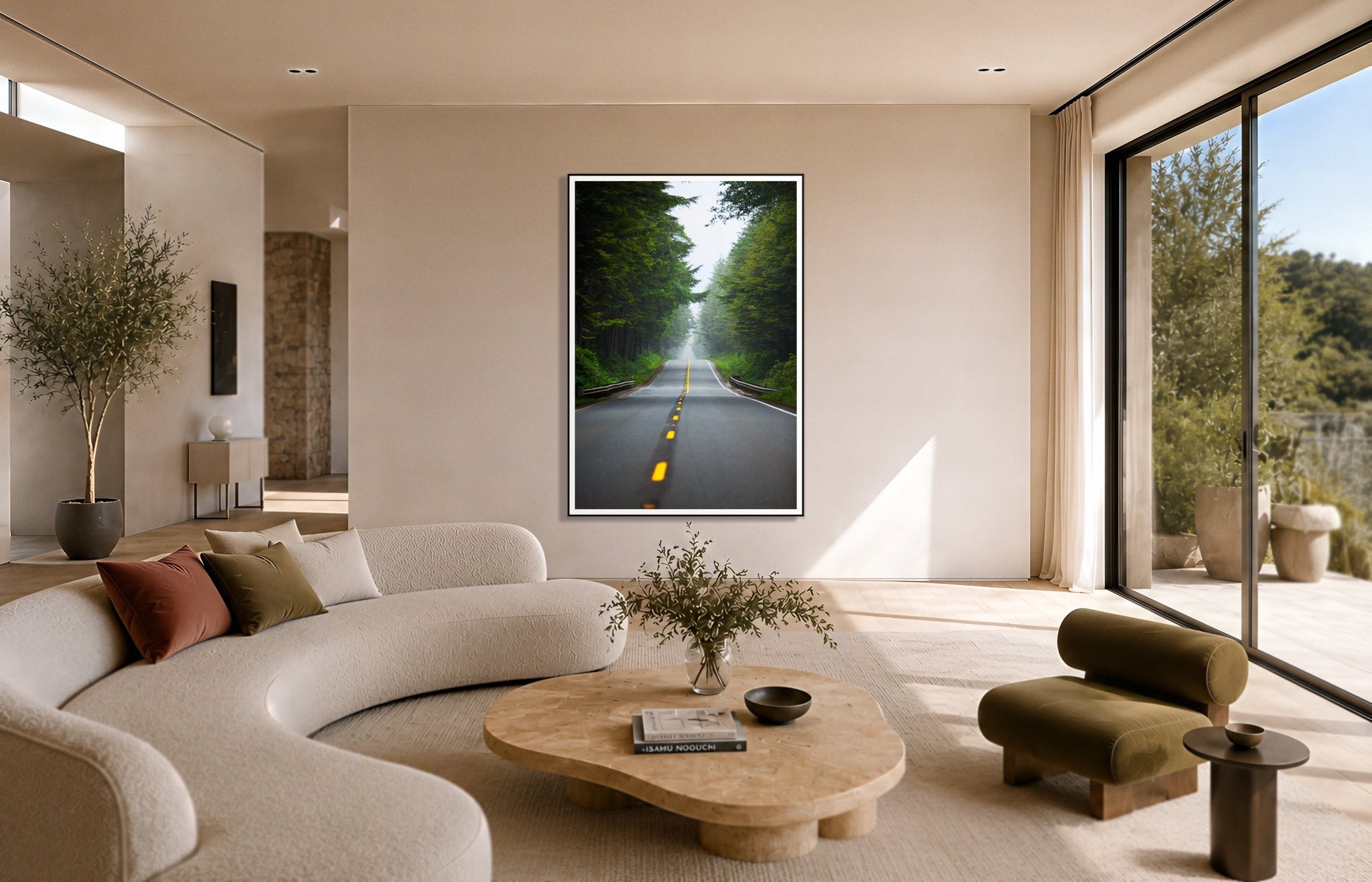 North West by Dylan Ozanich in a Black frame, above a cream curved sofa in a sunlit room with olive velvet seating