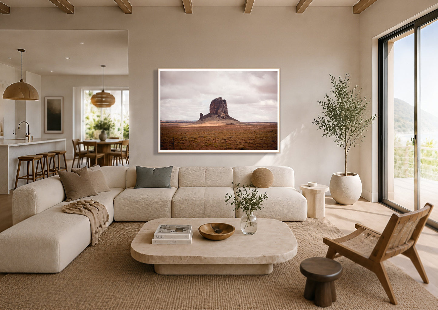 Nowhere New Mexico by Dylan Ozanich in an Oak frame, above a cream sectional in a coastal living room with an ocean view