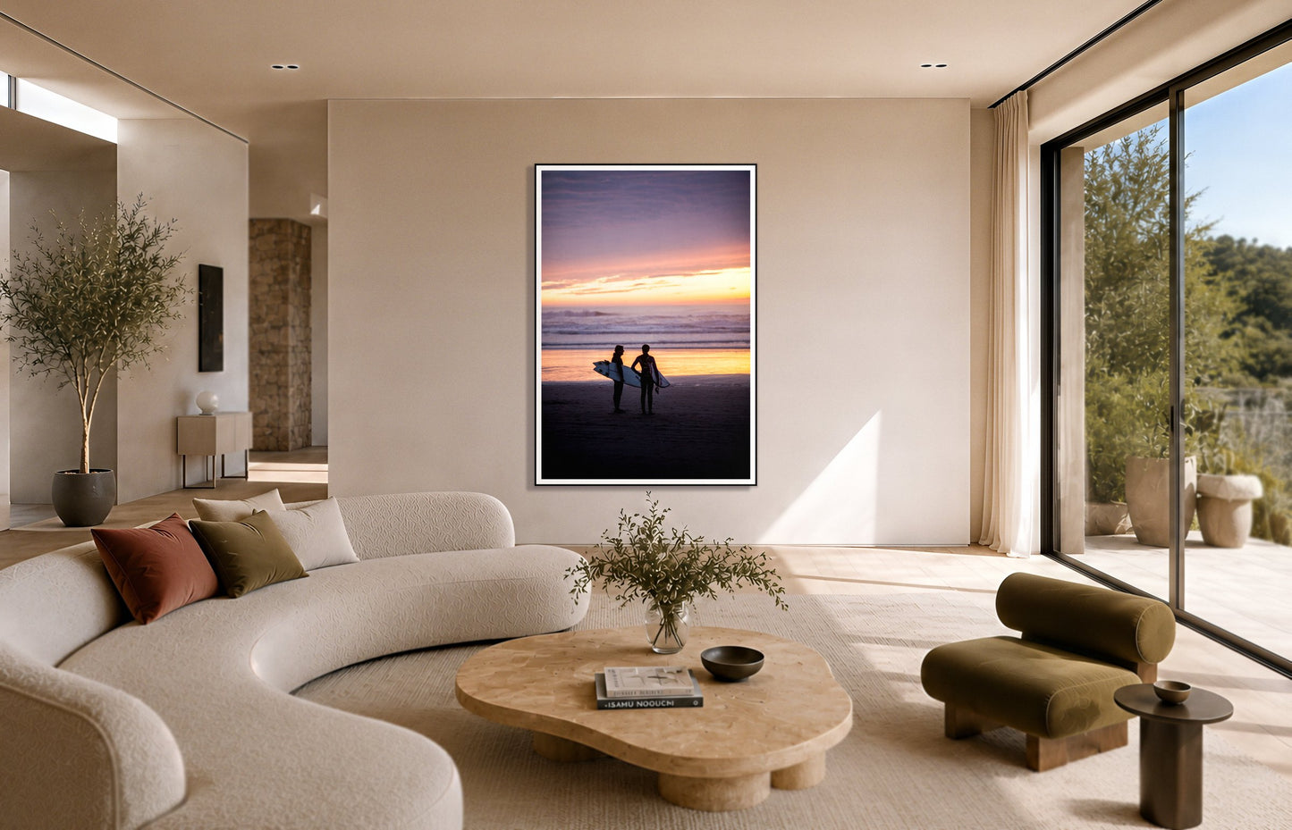 Ocean Beach Vibes by Dylan Ozanich in a Black frame, above a cream curved sofa in a sunlit room with olive velvet seating