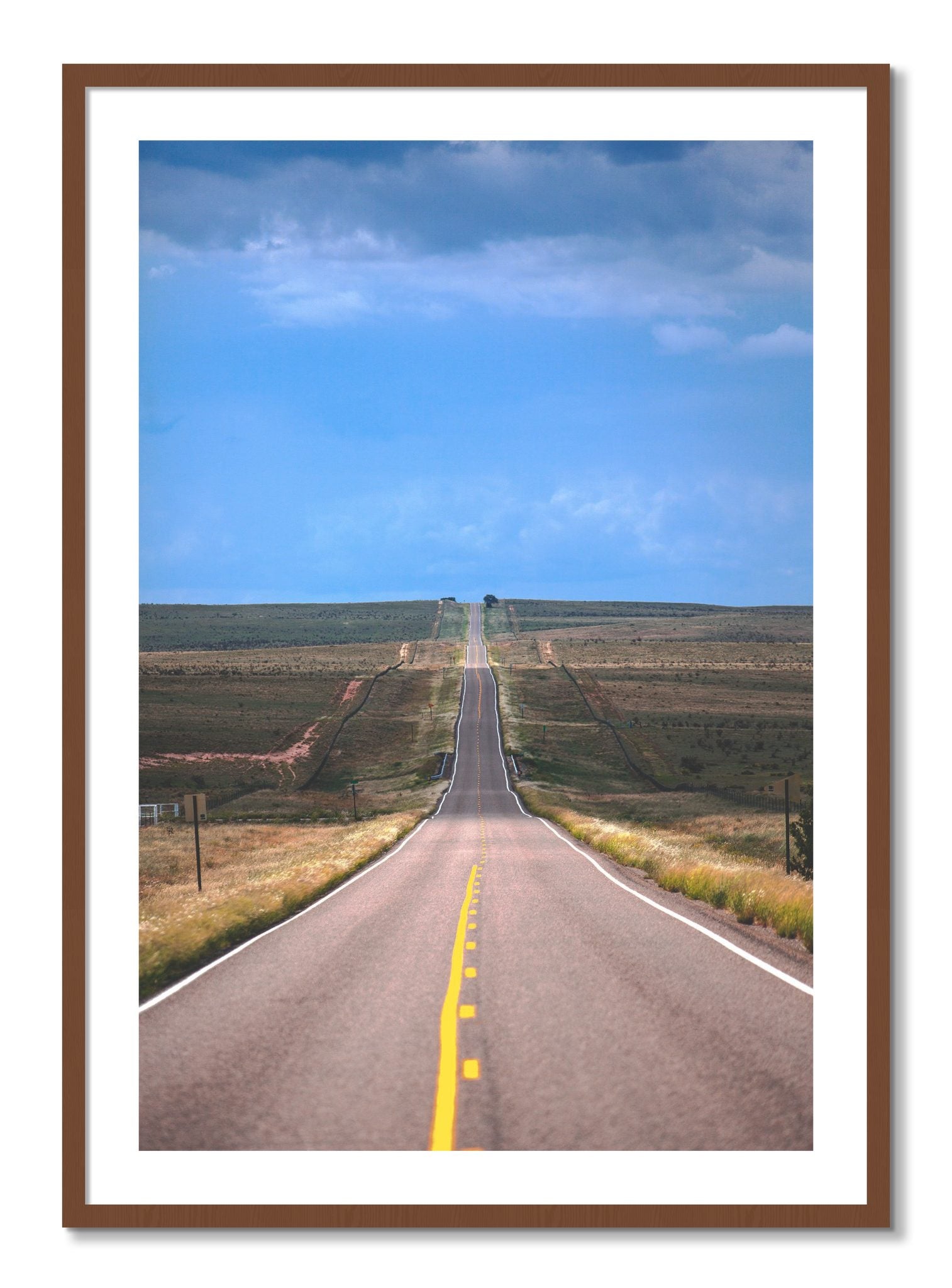 Framed photograph of Over The Hill by Dylan Ozanich, Walnut frame, Borders
