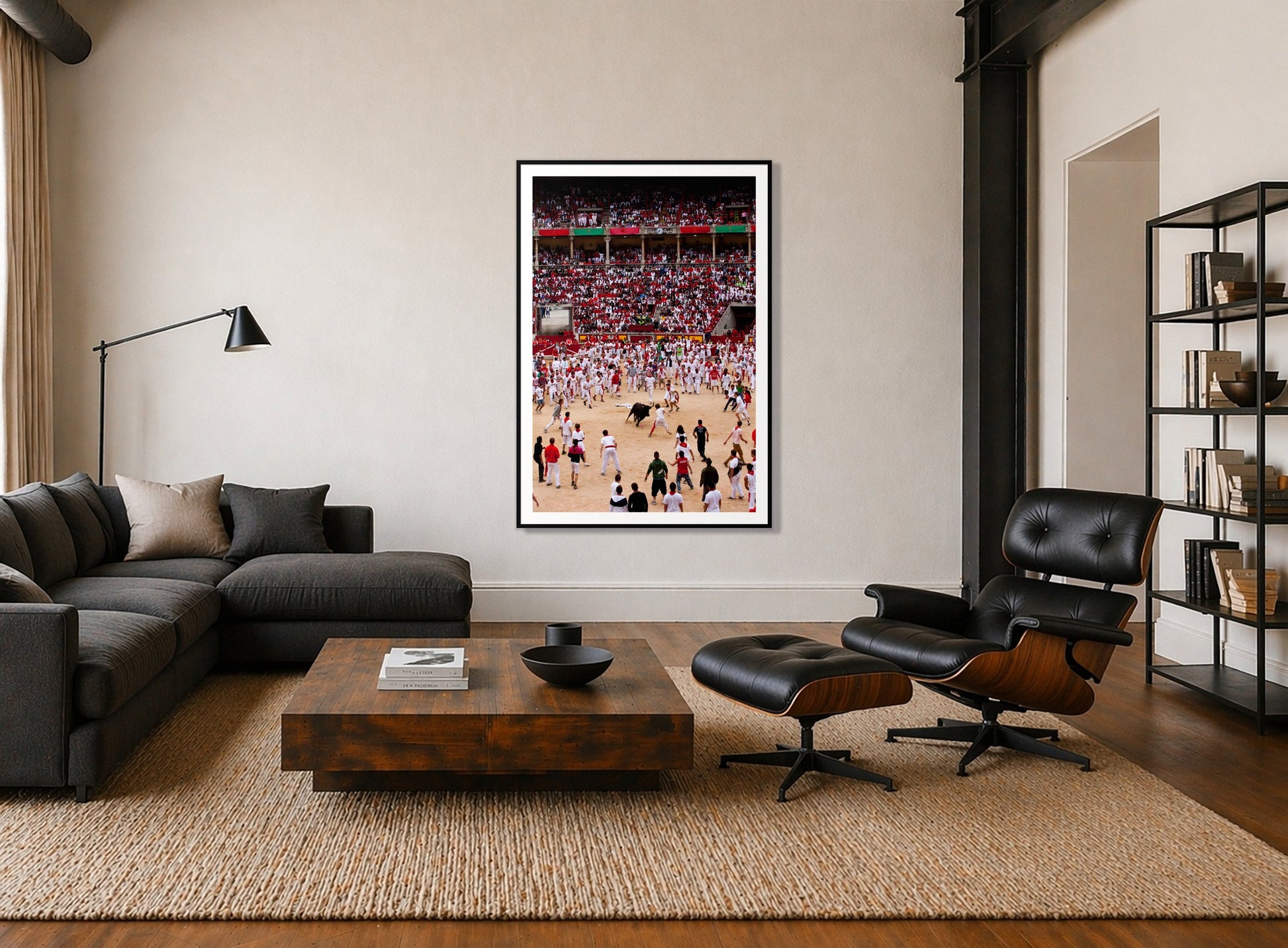 Panploma by Dylan Ozanich in a Black frame, above a dark sectional in a loft with a black leather lounge chair