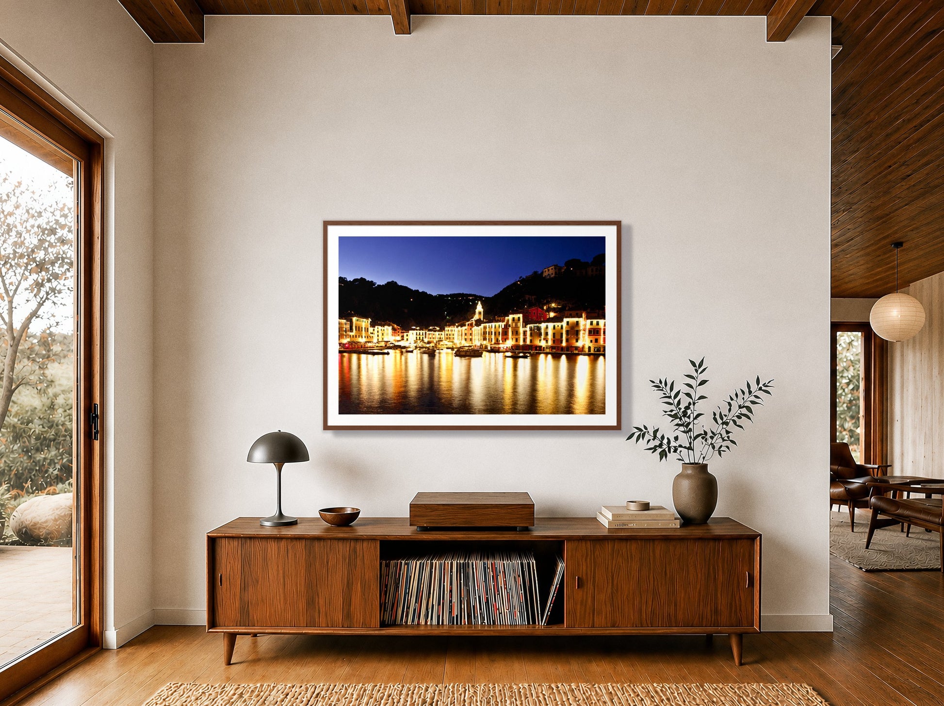 Portofino Reflection by Dylan Ozanich in a Walnut frame, above a walnut record credenza in a wood-beamed midcentury room