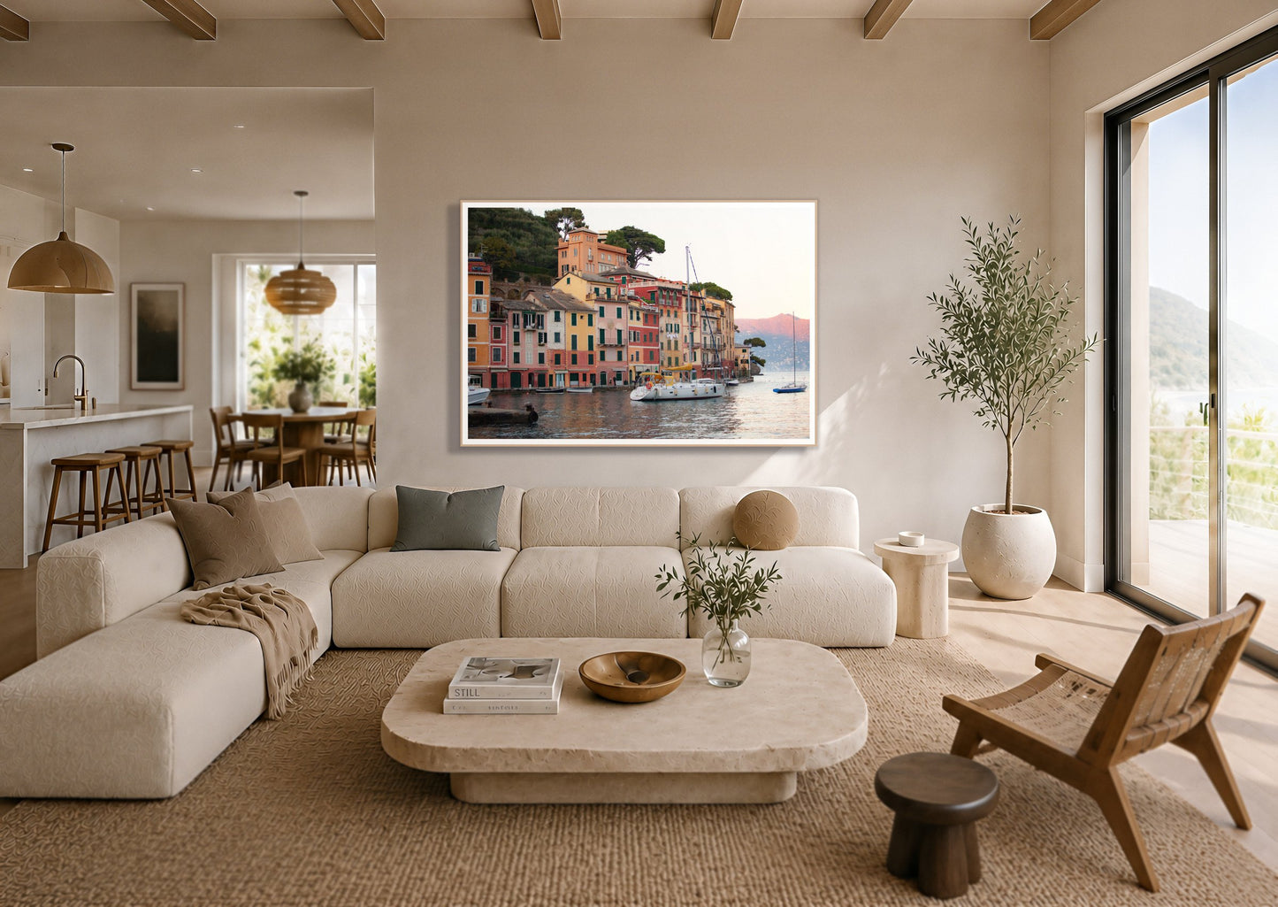 Portofino by Dylan Ozanich in an Oak frame, above a cream sectional in a coastal living room with an ocean view
