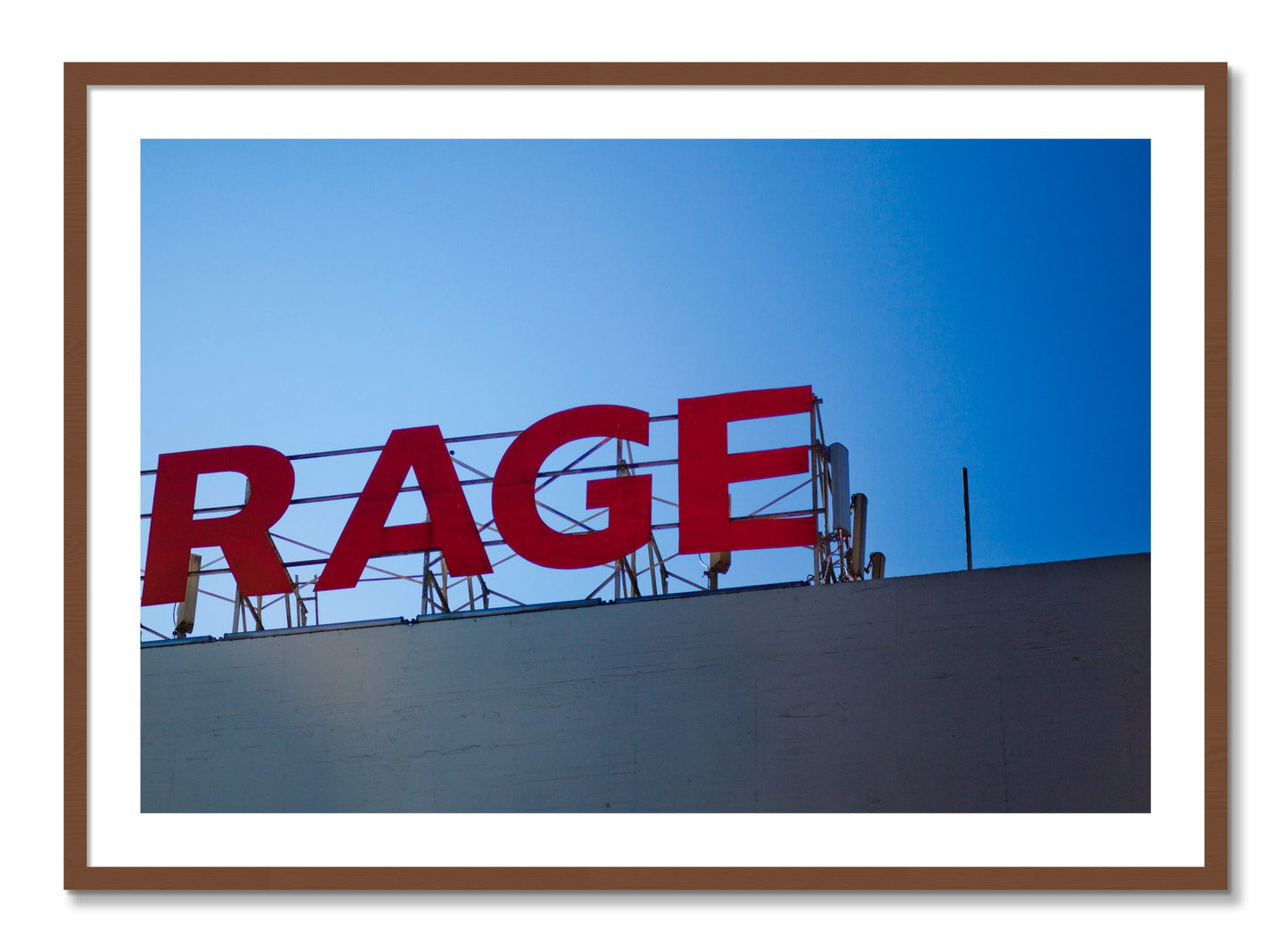 Framed photograph of Rage by Dylan Ozanich, Walnut frame, Borders