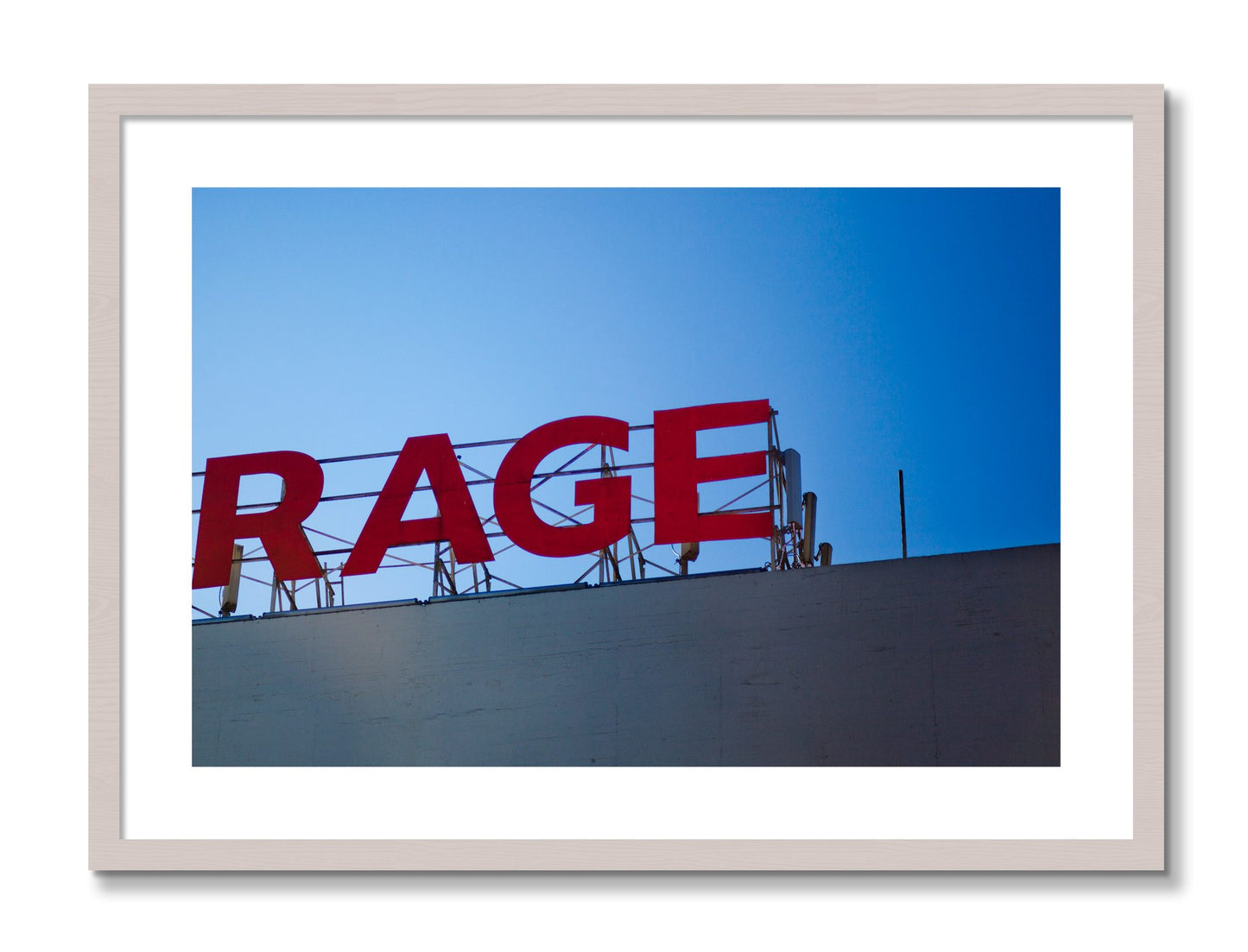 Framed photograph of Rage by Dylan Ozanich, White Maple frame, Borders