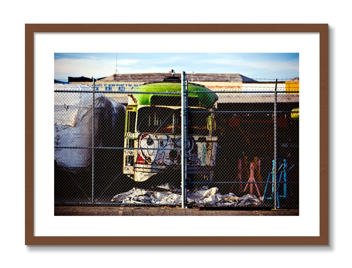 Framed photograph of Retired by Dylan Ozanich, Walnut frame, Borders