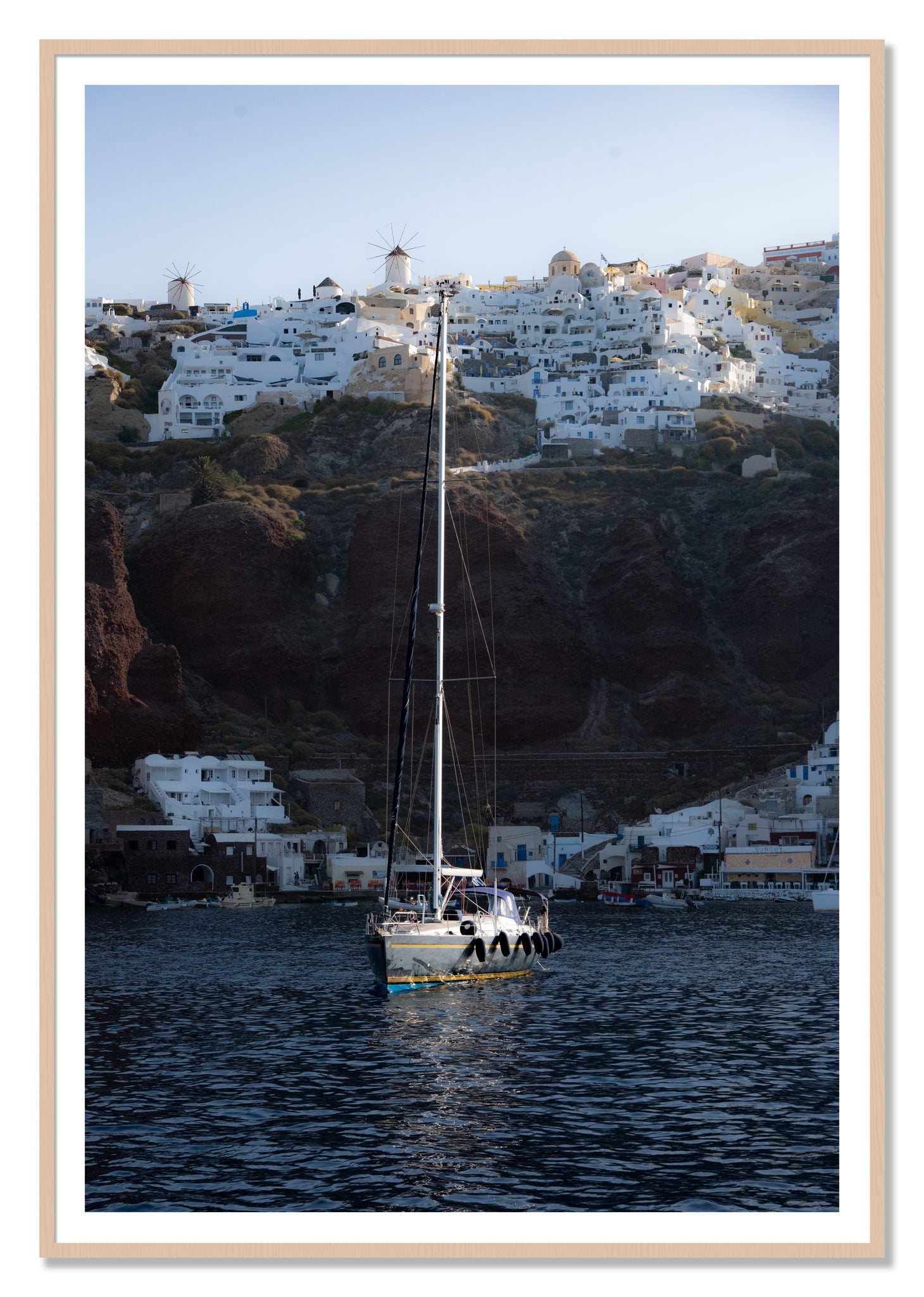 Sailing In Greece by Dylan Ozanich, 48×72 print with a White Border in a Maple frame
