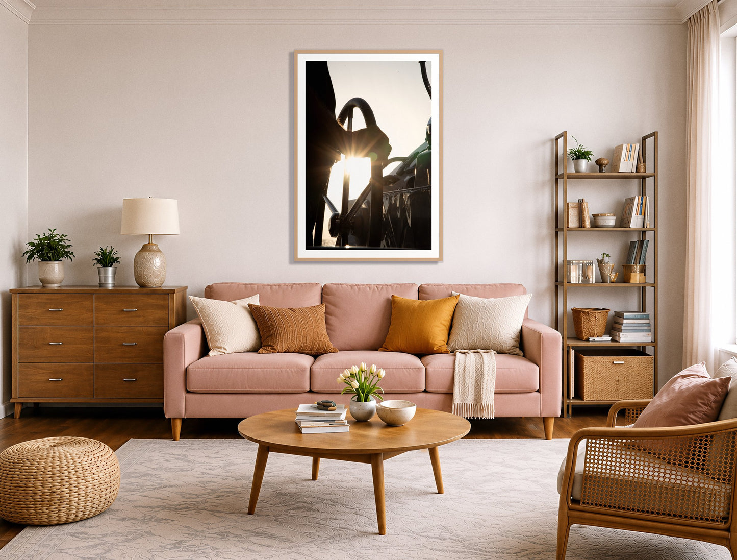 Sailing by Dylan Ozanich in an Oak frame, above a blush pink sofa in a warm, eclectic living room