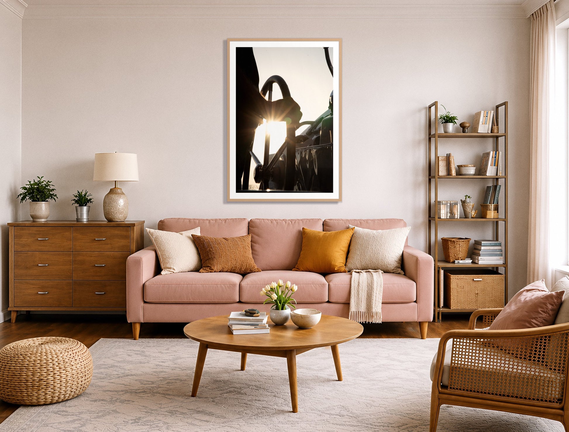 Sailing by Dylan Ozanich in an Oak frame, above a blush pink sofa in a warm, eclectic living room