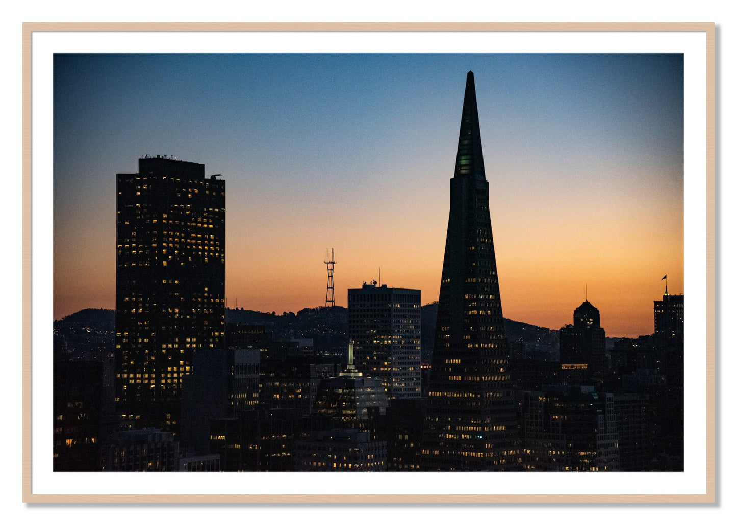 Framed photograph of San Francisco Skyline by Dylan Ozanich, Maple frame, Borders