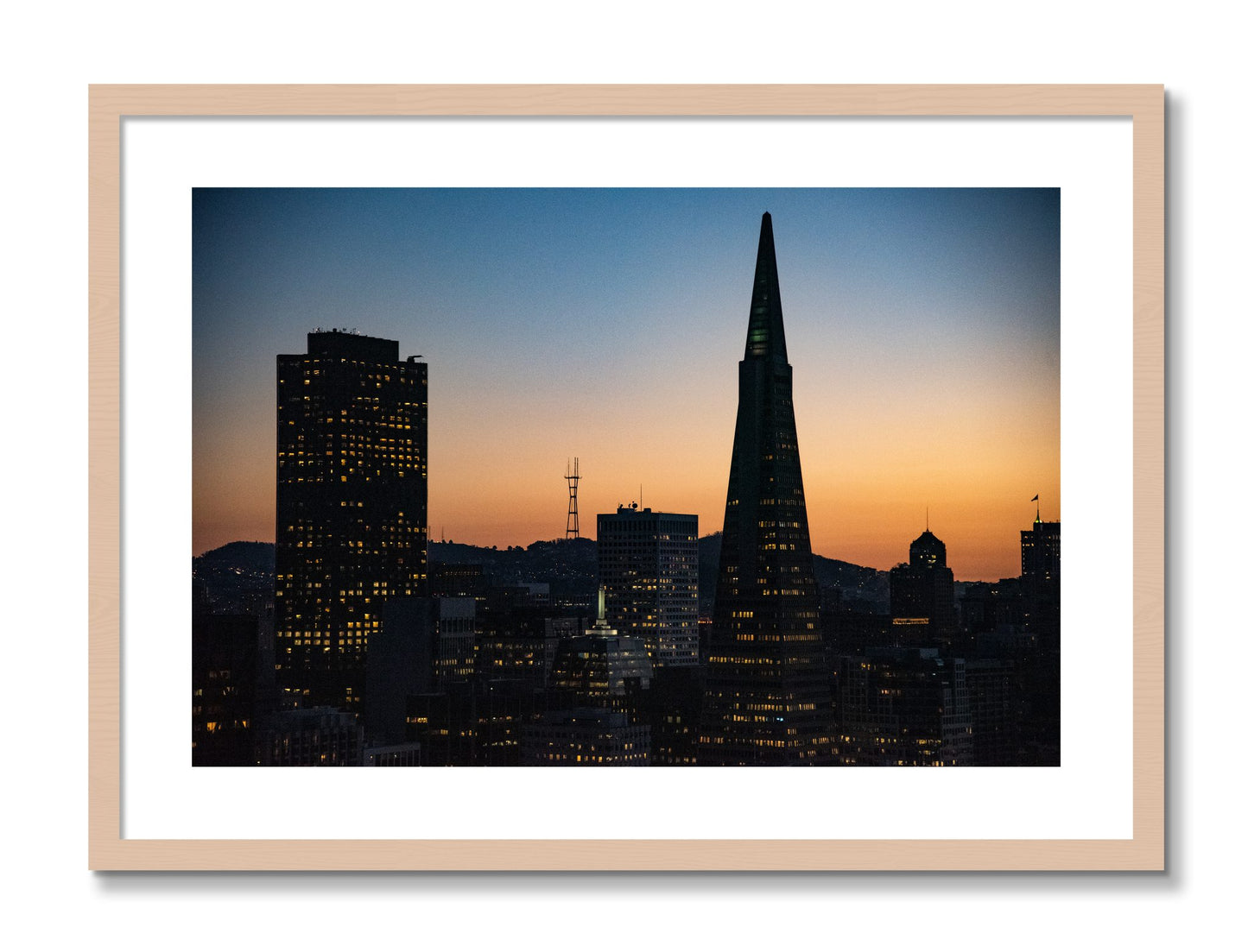 Framed photograph of San Francisco Skyline by Dylan Ozanich, Maple frame, Borders