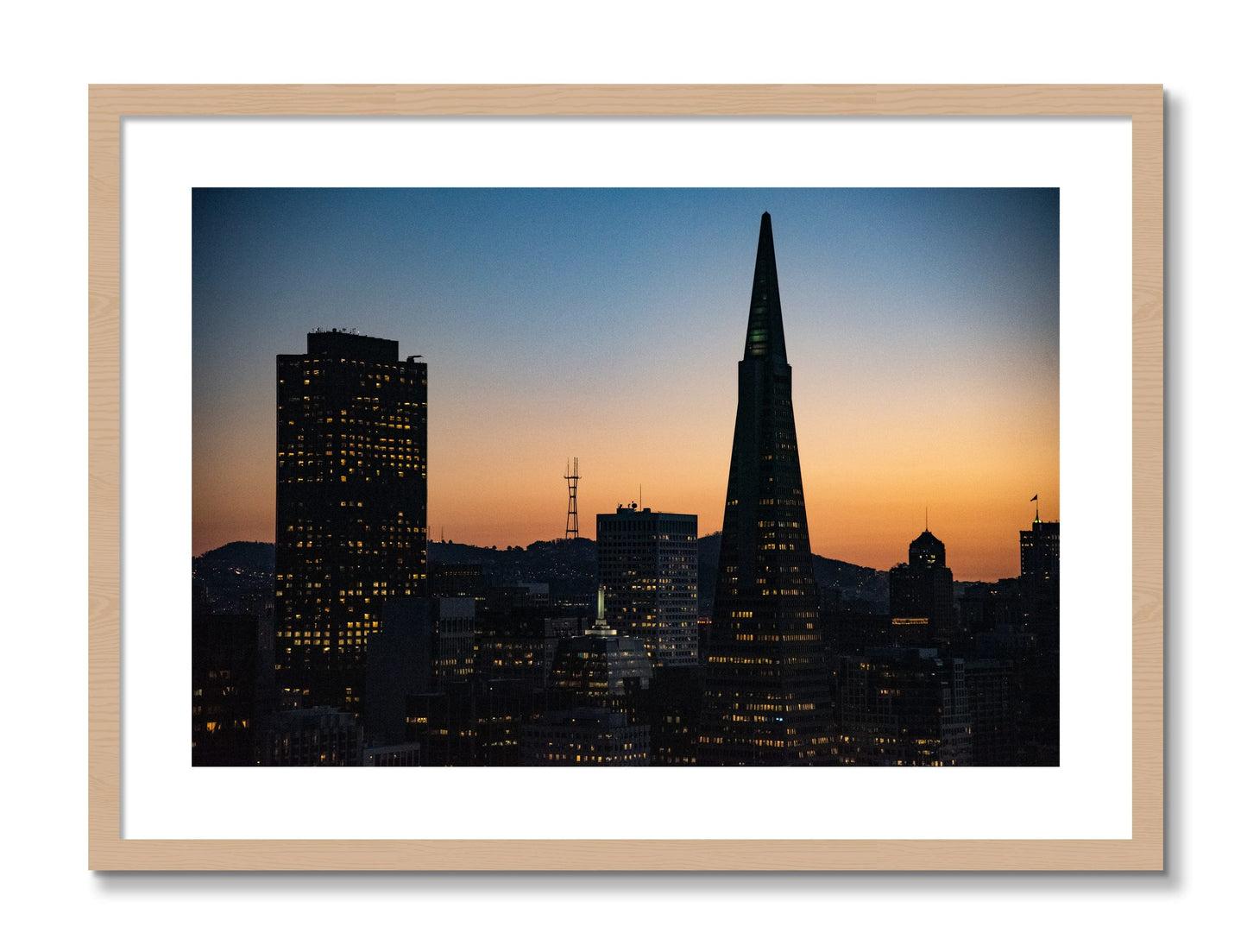 Framed photograph of San Francisco Skyline by Dylan Ozanich, Oak frame, Borders