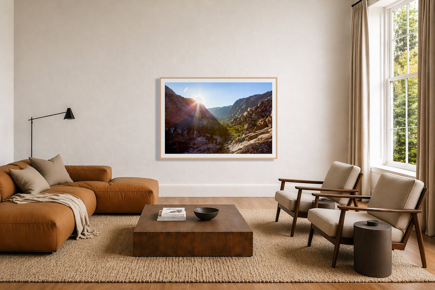 Framed photograph of Sierra Nevadas by Dylan Ozanich displayed on a wall