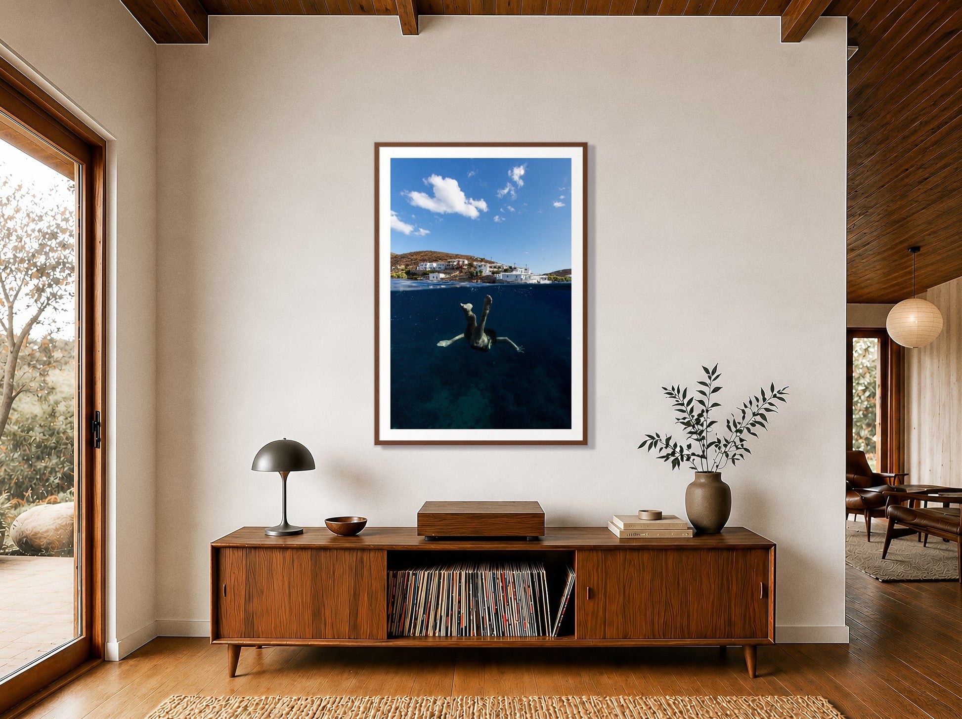 Split Sea by Dylan Ozanich in a Walnut frame, above a walnut record credenza in a wood-beamed midcentury room