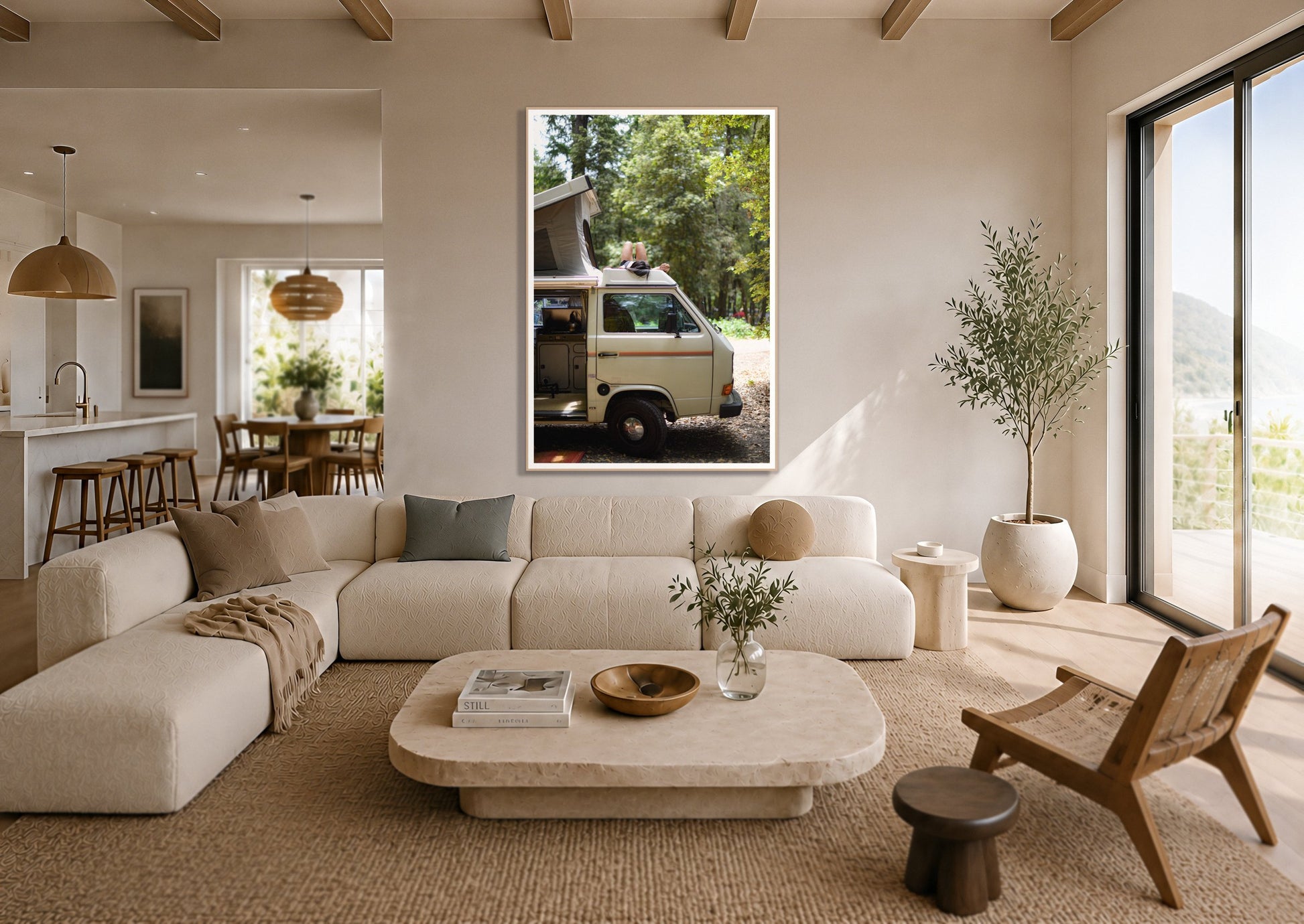 Standish Hicky by Dylan Ozanich in an Oak frame, above a cream sectional in a coastal living room with an ocean view