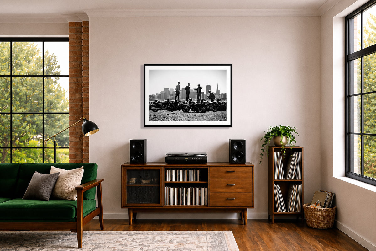 The Love For Riding by Dylan Ozanich in a Black frame, above a record credenza in a listening room with a green velvet sofa